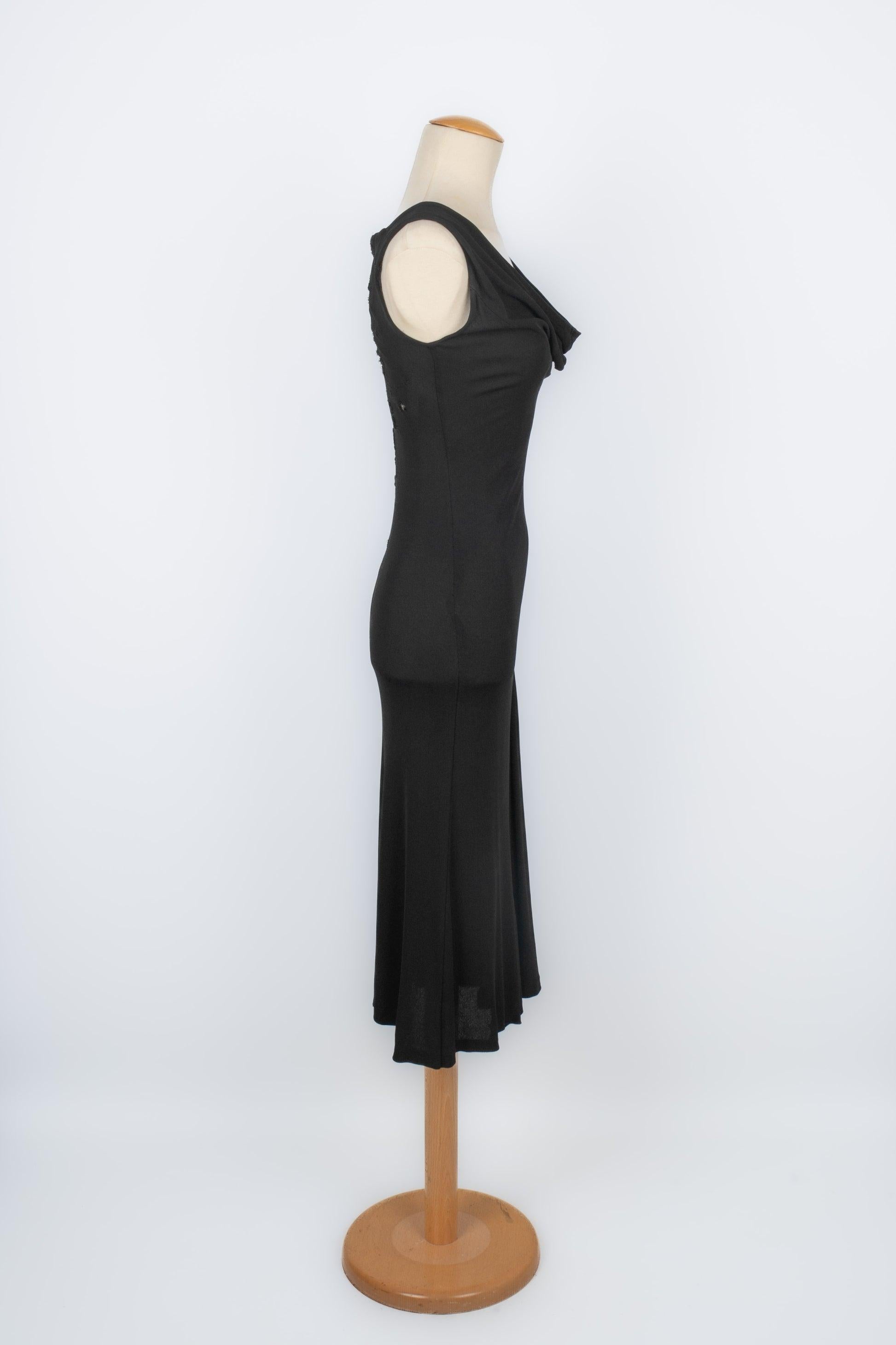 Jean-paul Gaultier -(Made in Italy) Long black mesh dress decorated with flower embroidery and black lace. No size indicated, it fits a 36FR.

Additional information:
Condition: Very good condition
Dimensions: Chest: 40 cm - Waist: 31 cm - Hips: 38