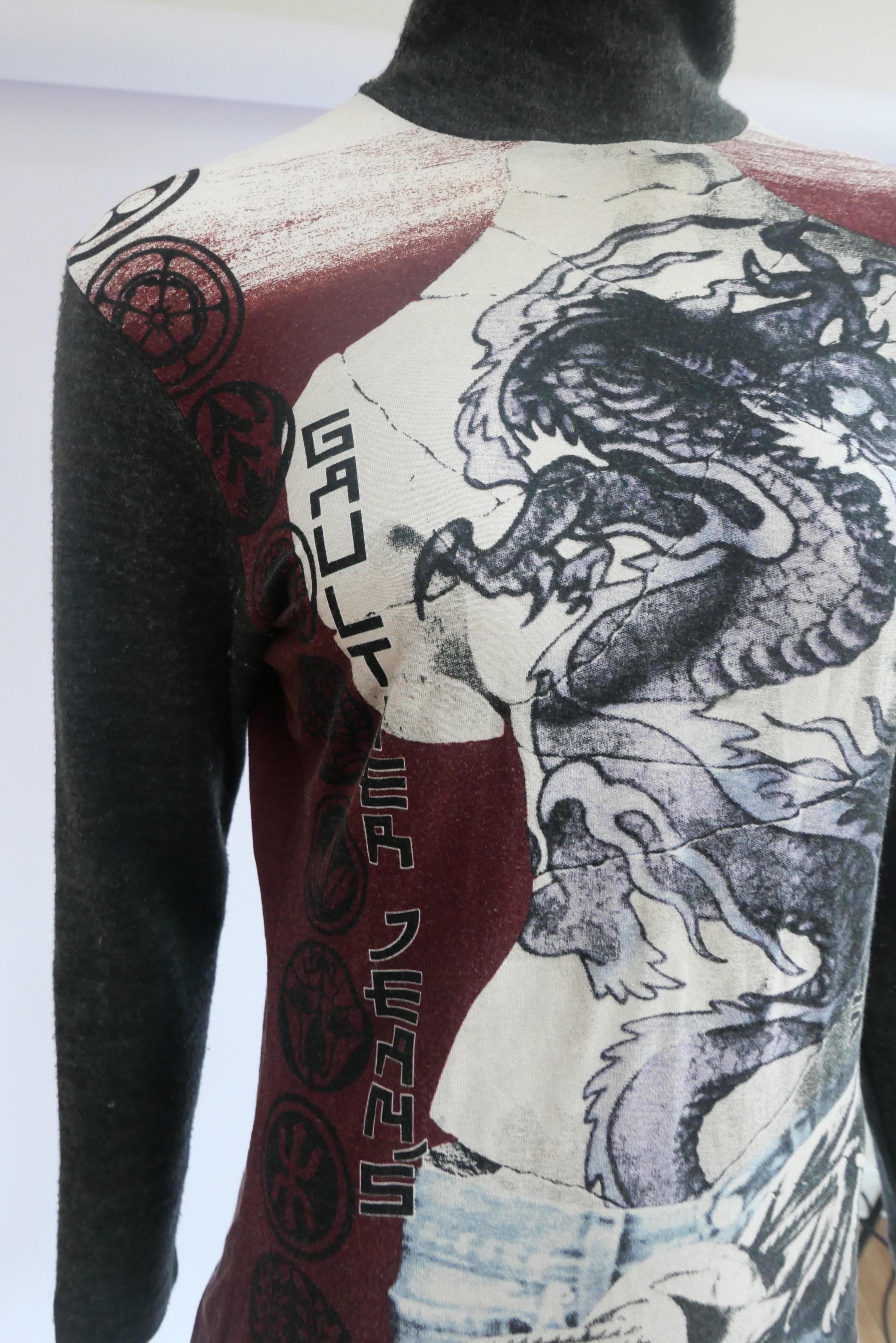 Jean Paul Gaultier Long Sleeve Venus Top
This piece is a turtleneck with the iconic Venus de milo print with a dragon tattoo. The piece is great as an everyday statement piece. Jean Paul Gaultier is a French haute couture and prêt-à-porter fashion