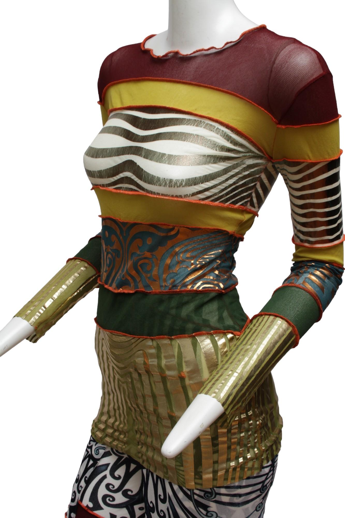 JEAN PAUL GAULTIER, Maille, long sleeve aboriginal print with metallic gold hem and cuffs. Maroon, yellow, metallic gold, bronze and copper foil print, multi-panel and multi aboriginal inspired prints. Mesh stretch. As shown with robe and pant, not