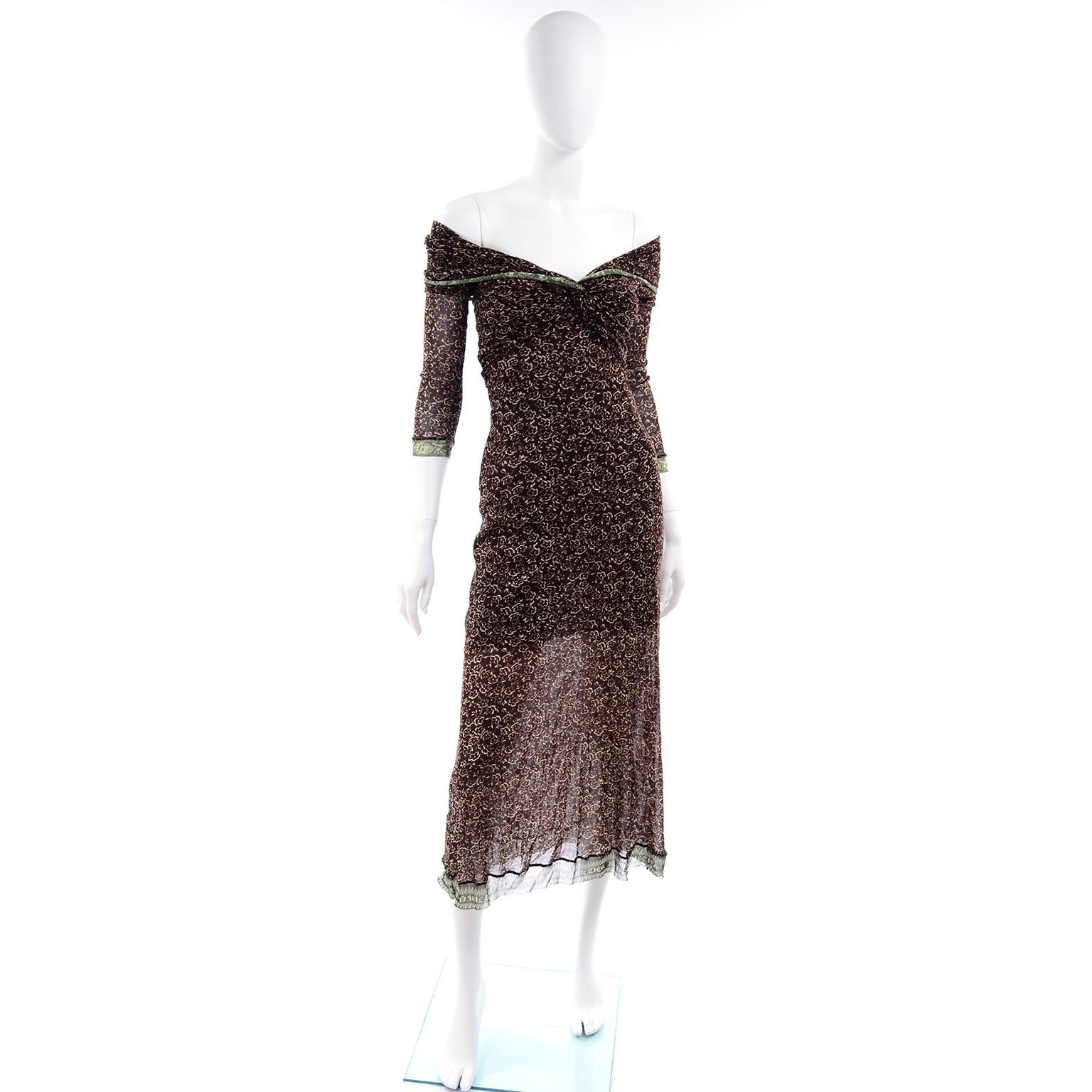 This is a beautiful vintage Jean Paul Gaultier Maille Classique dress in a brown and cream floral print with green trim with Jean Paul Gaultier monogram.  The micro mesh stretch dress has an almost off shoulder fit and stretches to fit a size small
