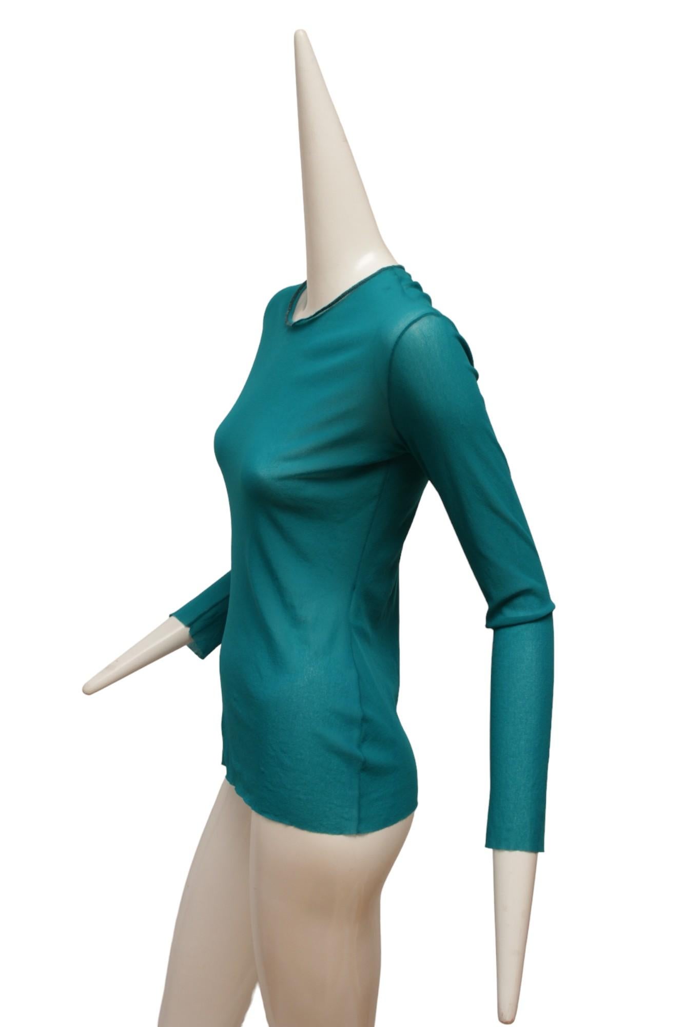 Jean Paul Gaultier Maille Classique Turquoise long sleeve top in the Iconic JPG stretch mesh. 

Made in Italy

Size; Medium. Measurements: Shoulder 14