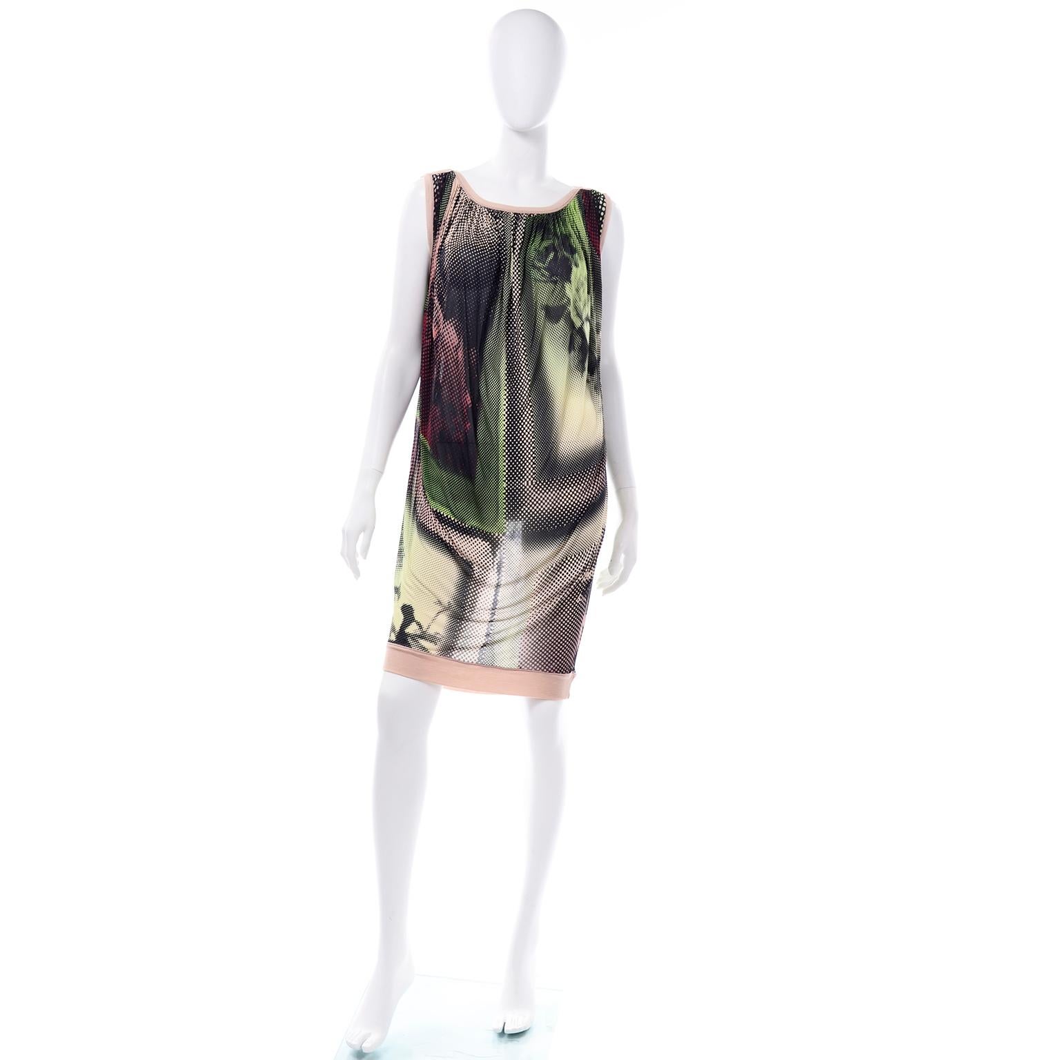We are obsessed with this Jean Paul Gaultier enlarged photograph dot print op art sleeveless dress! This print is very unique and playful with colors in shades of  nude pink, lime green, mauve, rust, black, and pale yellow. The neckline is a