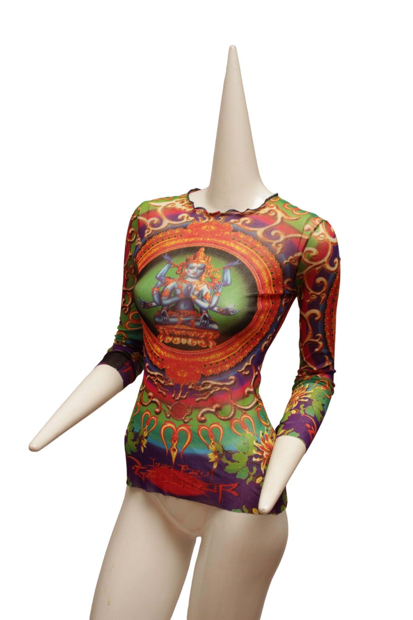 JEAN PAUL GAULTIER, Maille, MESH, Hindu G-d Shiva Butterfly Tattoo Long Sleeve Top. 

Top has deep and vibrant cyan and magenta hues. As styled with matching skirt, not included.

Size S/M

Back length: 24