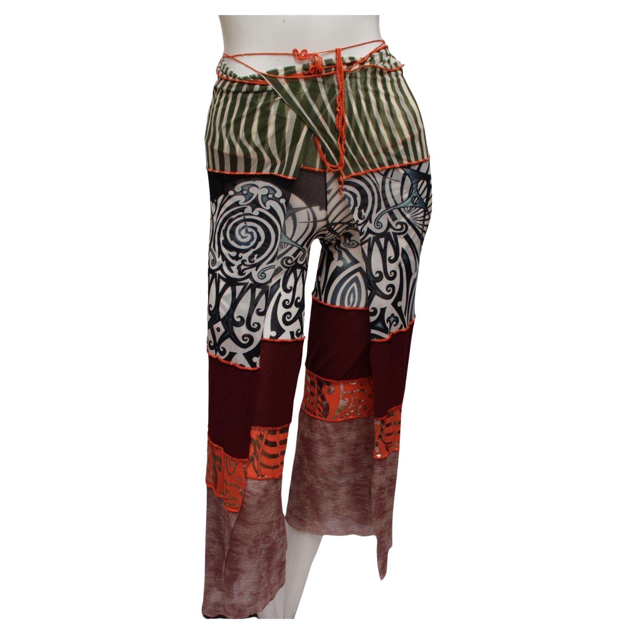 EAN PAUL GAULTIER, Maille, Mesh stretch multi-panel with Maori inspired print pant that is a convertible piece. It can be worn as skirt, halter jumpsuit, or how ever your imagination inspires you!  As shown with robe and matching long sleeve top,