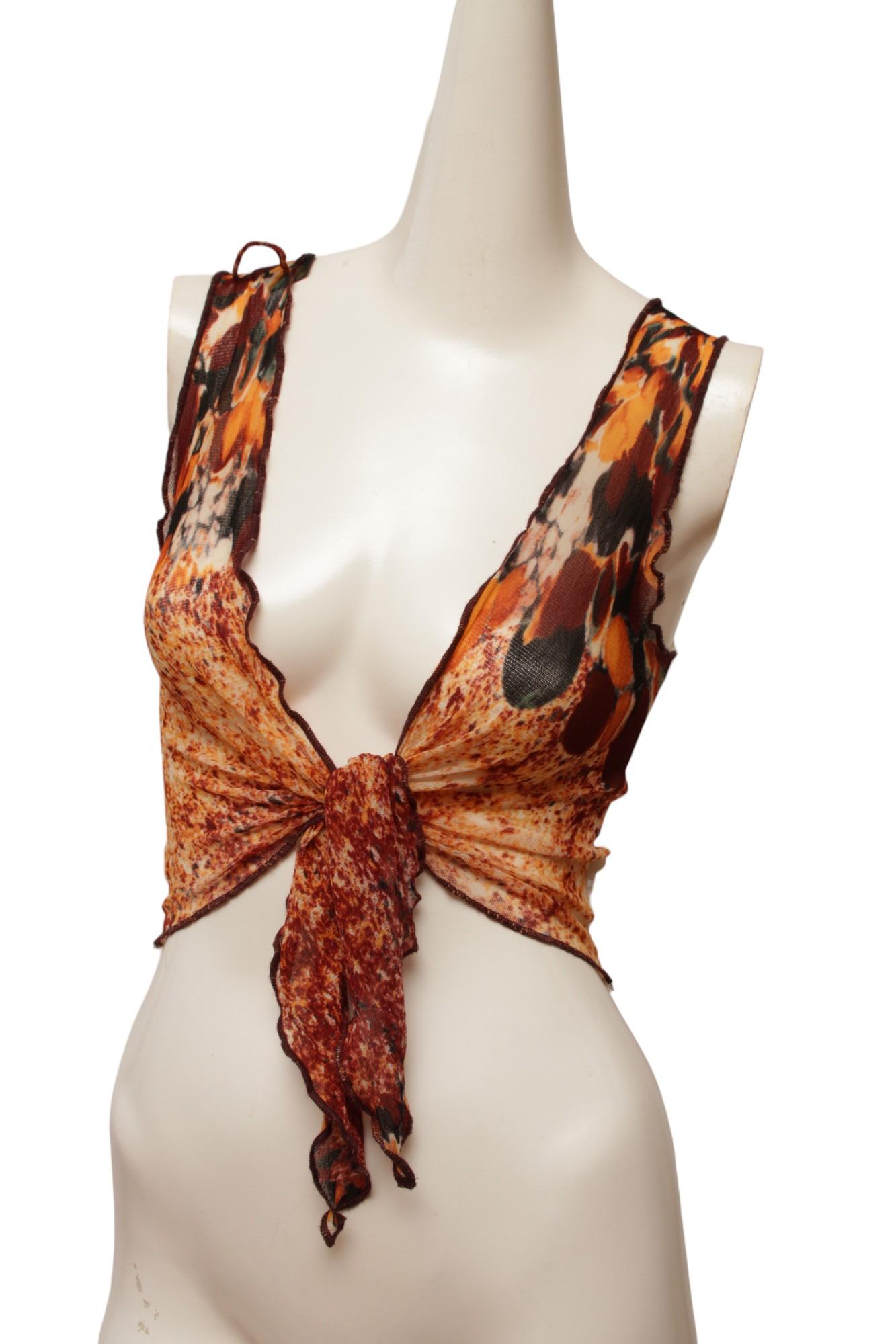 Jean Paul Gaultier Maille Red, Navy, and Orange Mesh Vest with tie front and a Cream rib knit back. Shown with matching long sleeve shirt, not included.

Made in Italy.

Size; Medium. Measurements ; Shoulder 10.5