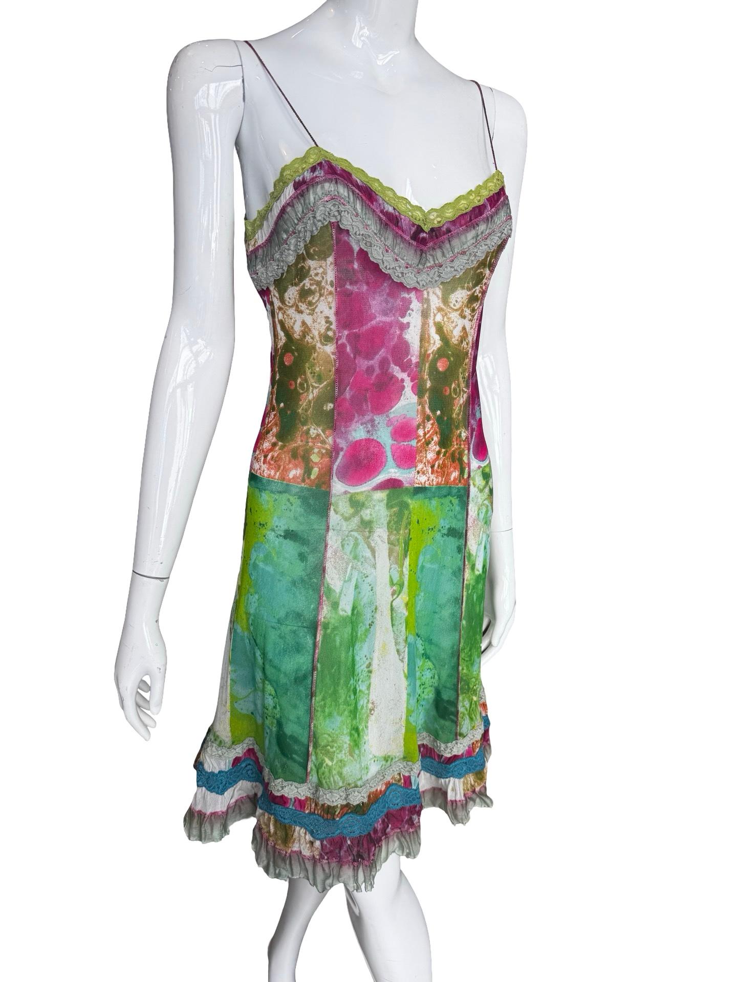 Incredible JPG mesh dress in a tie dye patchwork style of contrasting marble style dying, overedge stitching and a lace detailing around the neckline and the hem.   Size M and could work on a M or a L with stretch.  

Bust 17-20