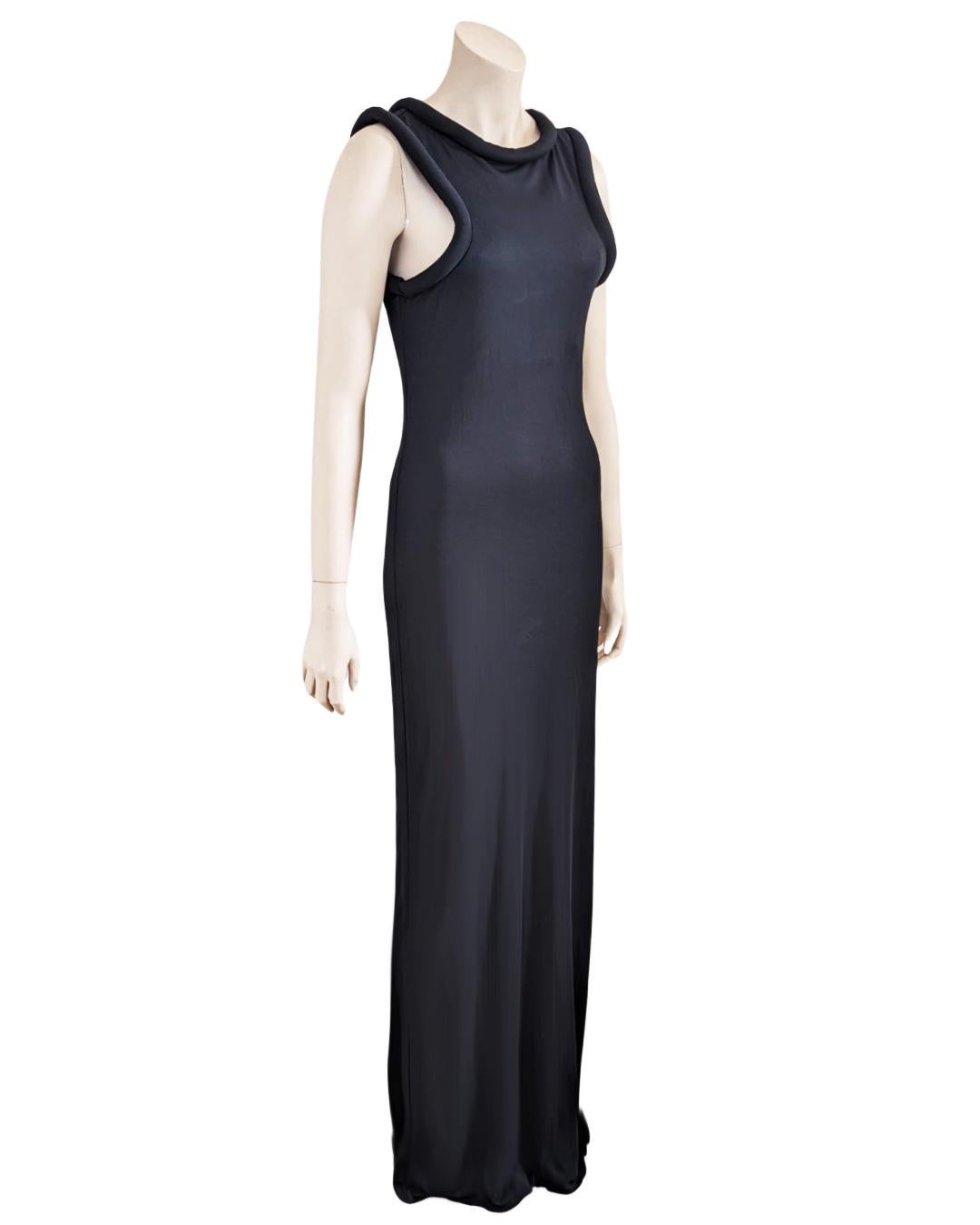 By Jean Paul Gaultier Deep Black Sleeveless Maxi Dress Cuff Collar 1995s.

· Oversize padded trim at collar and arms
· Tank Top
. No transparency
. Slip on
 

Size Fits M L

Measurements :
Breast 48cm
Waist 47cm
Length 147 cm 
 
Colors :