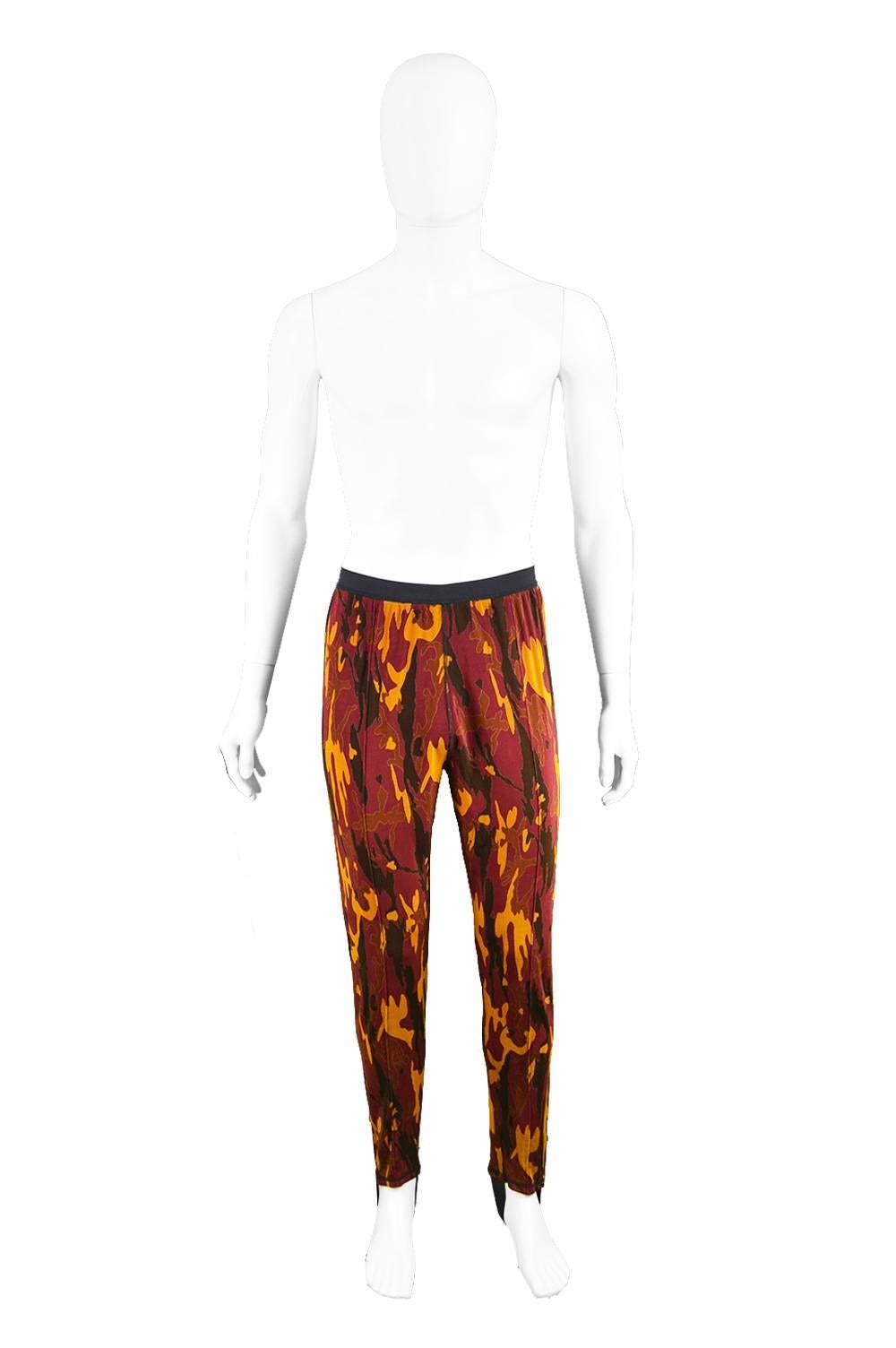 Jean Paul Gaultier Men's Red Camo Mesh Trousers with Stirrup Details, 1980s

Size: Marked 52 which is roughly a men's Large but will also fit a Small to Medium due to elasticated waist. Please check measurements.
Waist - Stretches from 28 - 34” / 71