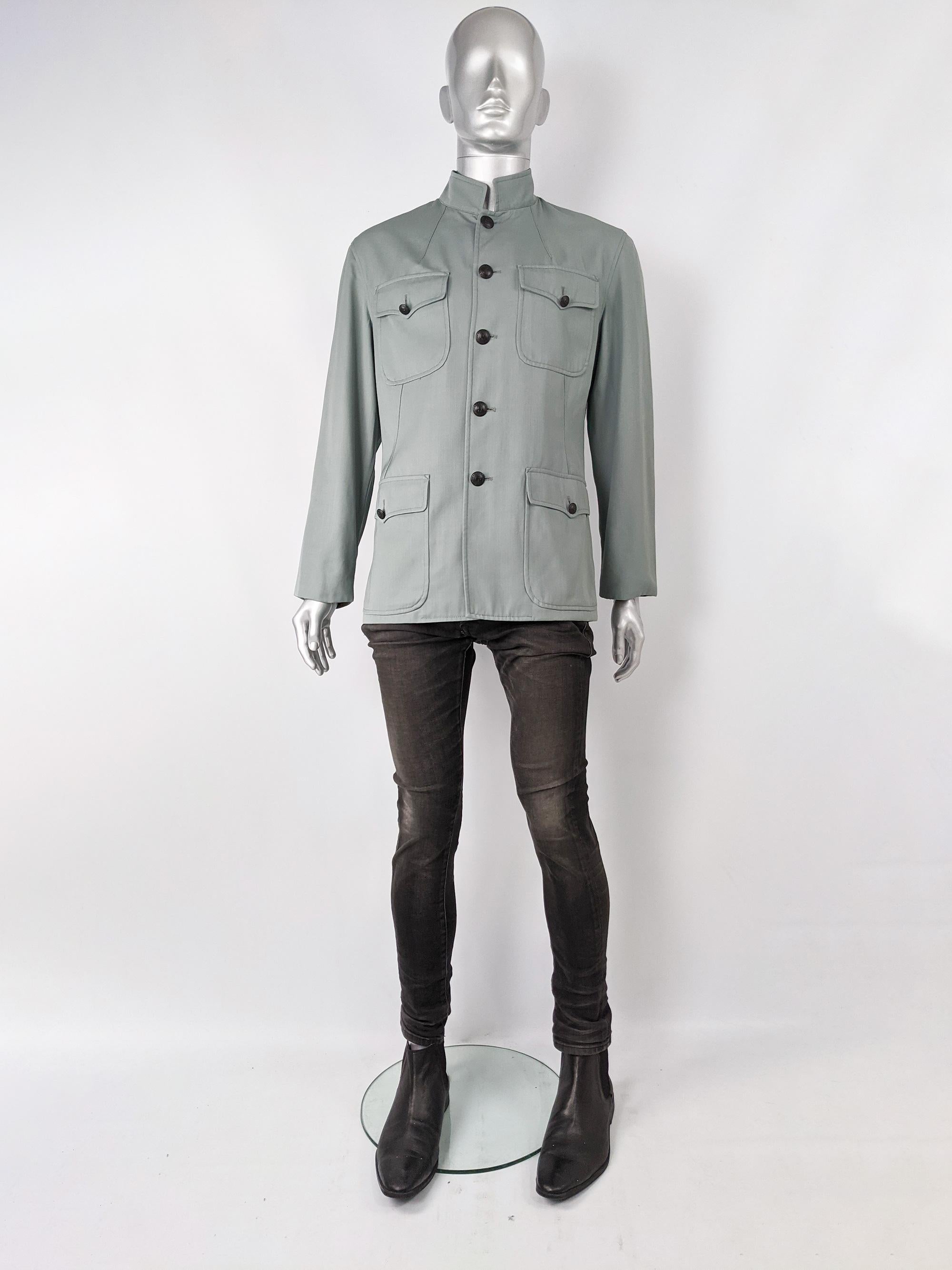 An excellent vintage men's Jean Paul Gaultier jacket from the 1990s in a pale military green with a nehru collar and multiple utility flap patch pockets on the front. Perfect for spring.
 
Size: Marked I 52 / E 52 / GB 42 / US 42 which is roughly a