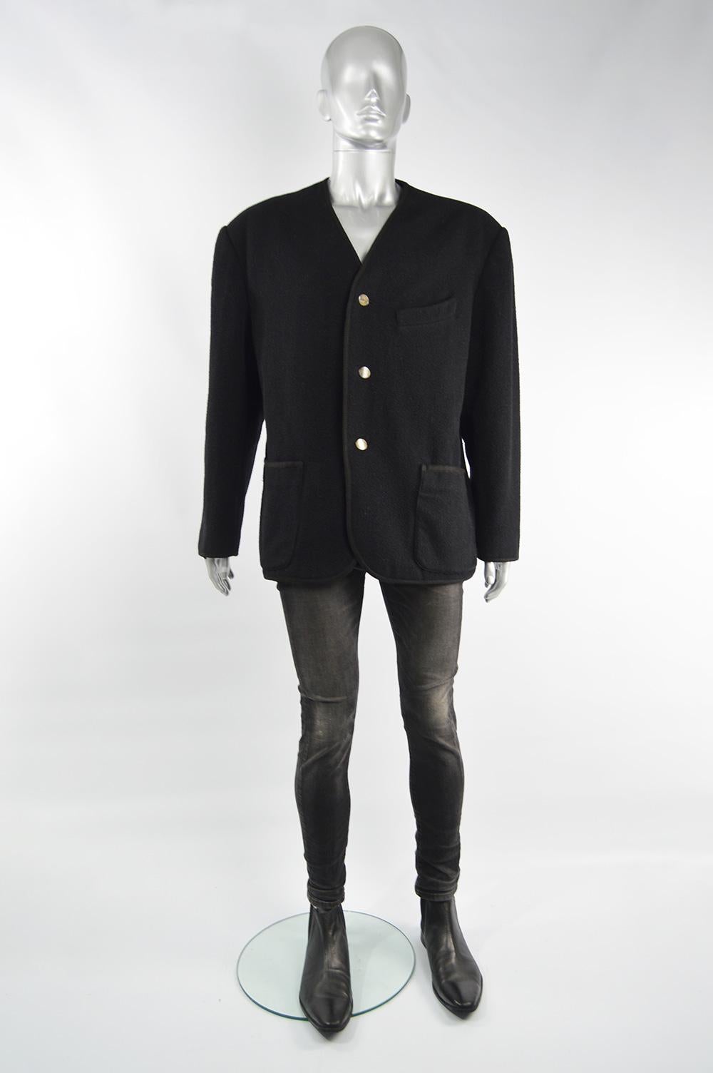 A bold vintage men's Jean Paul Gaultier blazer jacket from the 80s in a black wool with a braided trim, collarless design and shoulder pads giving an edgy silhouette. 

Size: Marked L but this gives an intended slightly loose fit so would also suit
