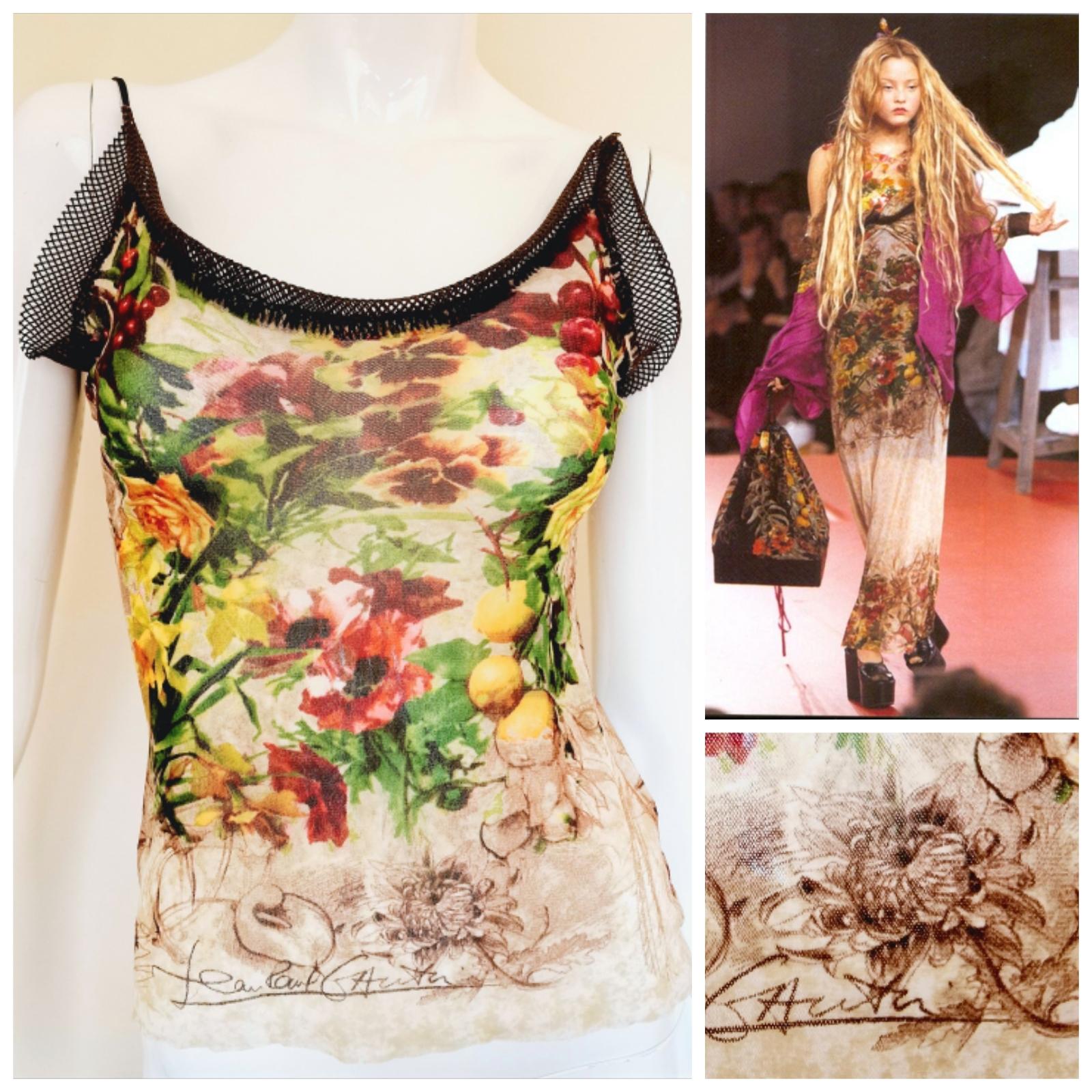 Floral Mesh Top by Jean Paul Gaultier! From the Summer Spring 1999 collection!

Very good Condition!

SIZE
Women: fits from medium to XL. 
Men: fits from small to large.
Marked size large. 
Very stretchy fabric! 
Length (can be adjust by the