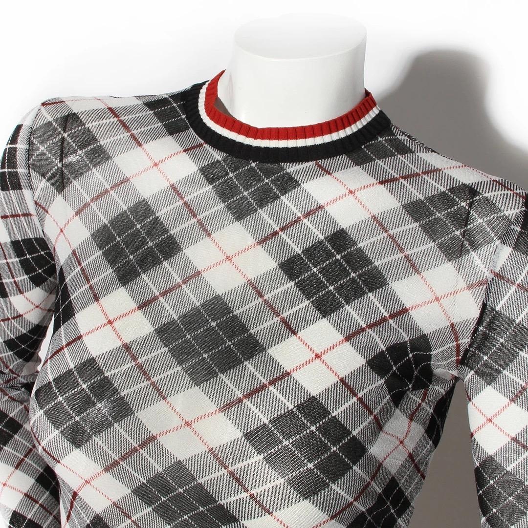 Jean Paul Gaultier Long Sleeve Sheer Mesh Top 
Made in Italy 
Circa 2000's
Plaid print 
Black, white and red 
Tricolor rib knit collar 
Fabric has stretch and elasticity 
Fabric Composition; 100% Nylon 
Excellent condition; Preloved with no visible