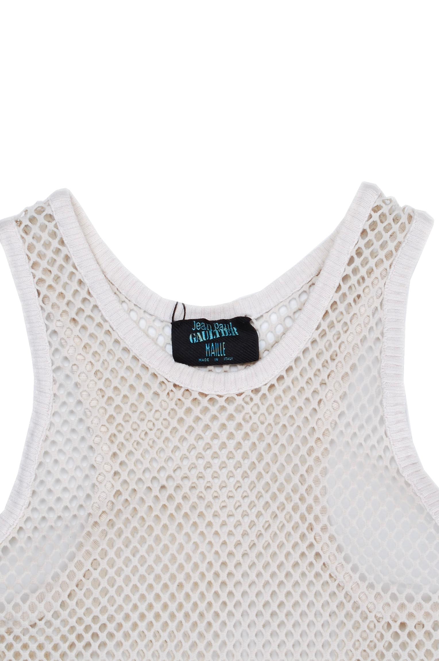Item for sale is 100% genuine Jean Paul Gaultier Mesh Top Men T-Shirt 
Color: Cream
(An actual color may a bit vary due to individual computer screen interpretation)
Material: No tag, seems cotton blend
Tag size: S/M
This t shirt is great quality