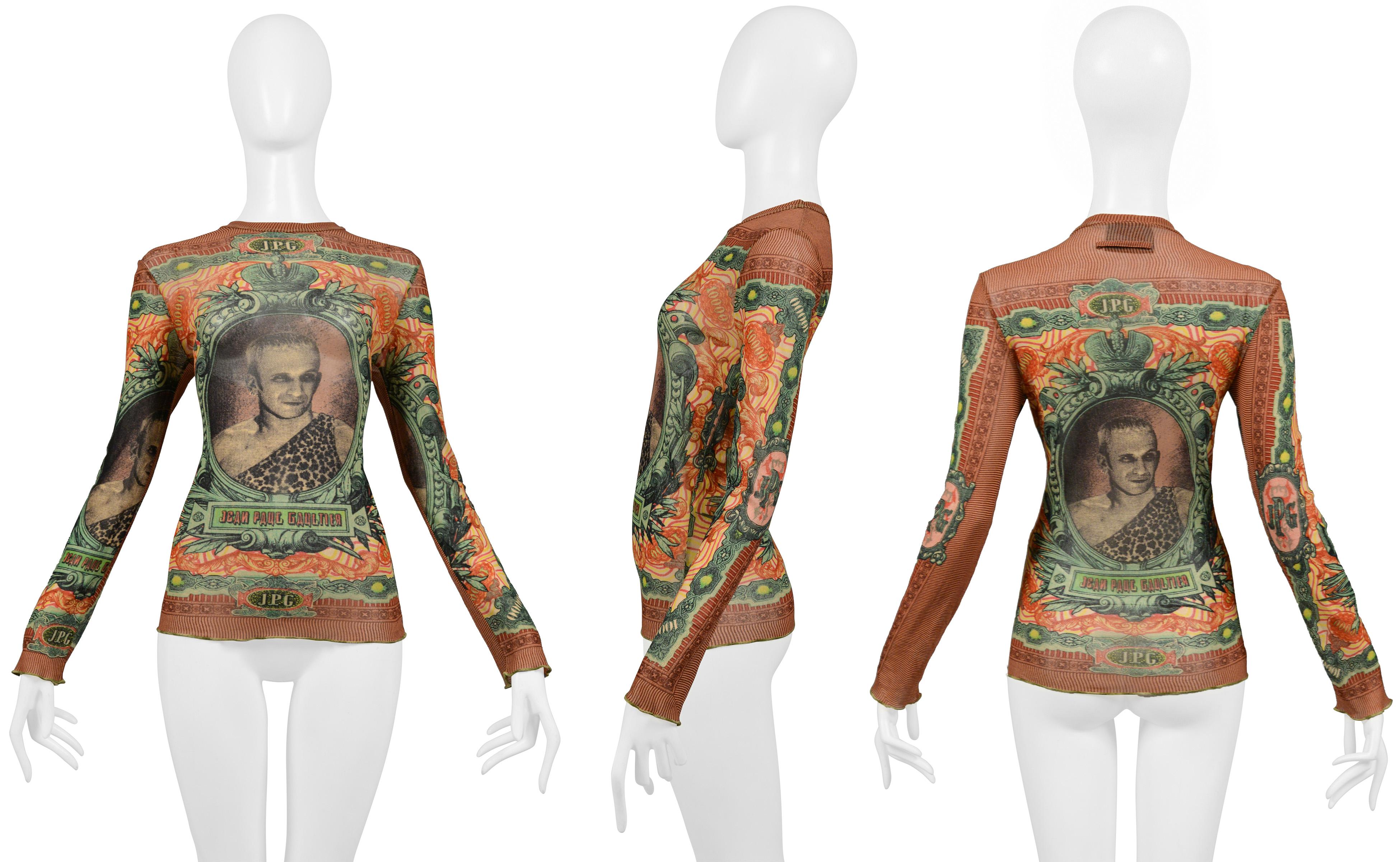 Resurrection Vintage is excited to offer a vintage Jean Paul Gaultier 1994 multicolor print stretch mesh top featuring a portrait of Gaultier, long sleeves, and fitted body.
	•	Jean Paul Gaultier
	•	Size: No label- Today's size S/M
	•	Fabric: 100%