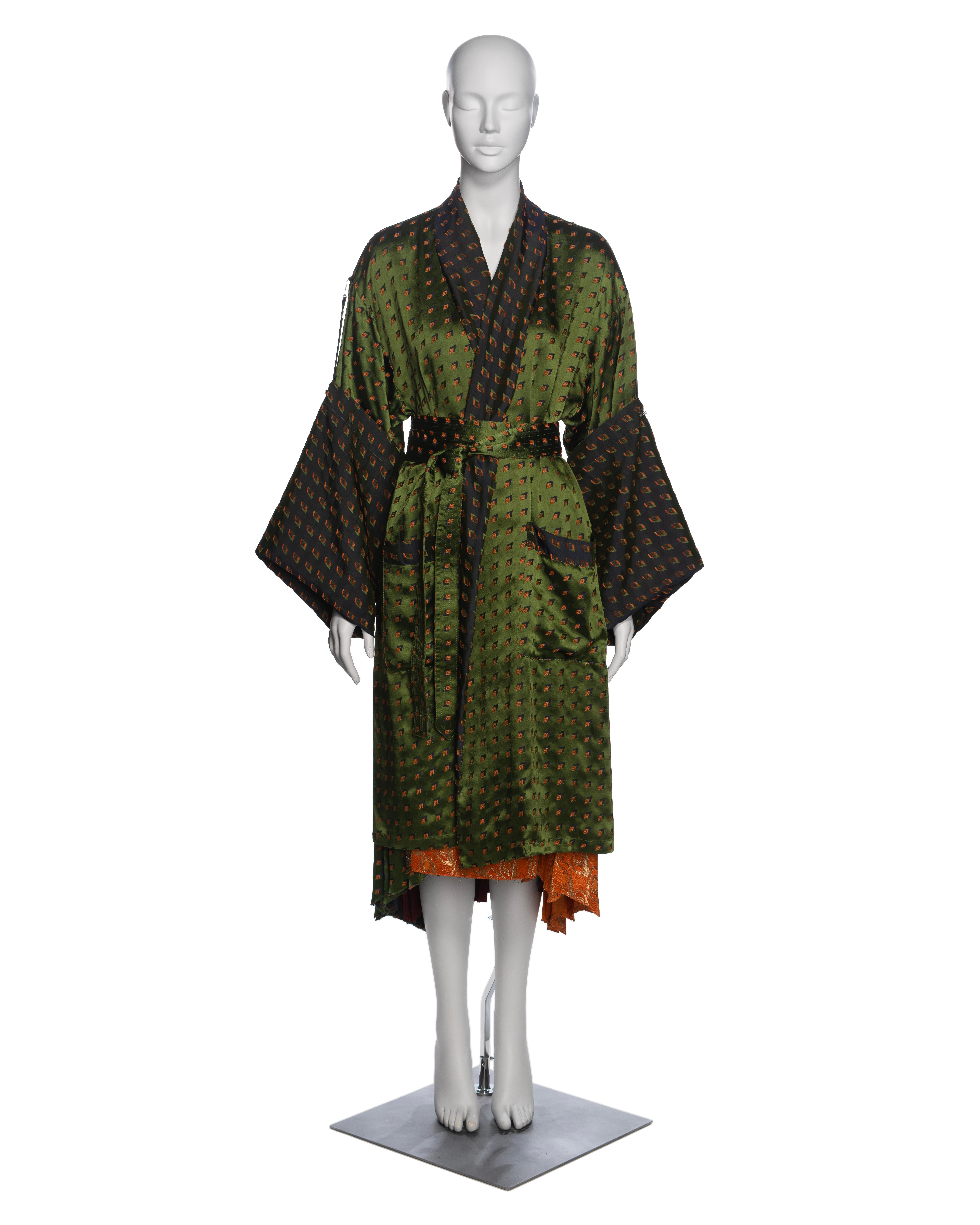 ▪ Brand: Jean Paul Gaultier
▪ Creative Director: Jean Paul Gaultier
▪ Collection: Fall-Winter 2002
▪ Fabric: Damask, Leather
▪ Details: Oversized kimono-style wrap jacket features wide-cut turn-up sleeves, a metal hook and cord fastening, and a