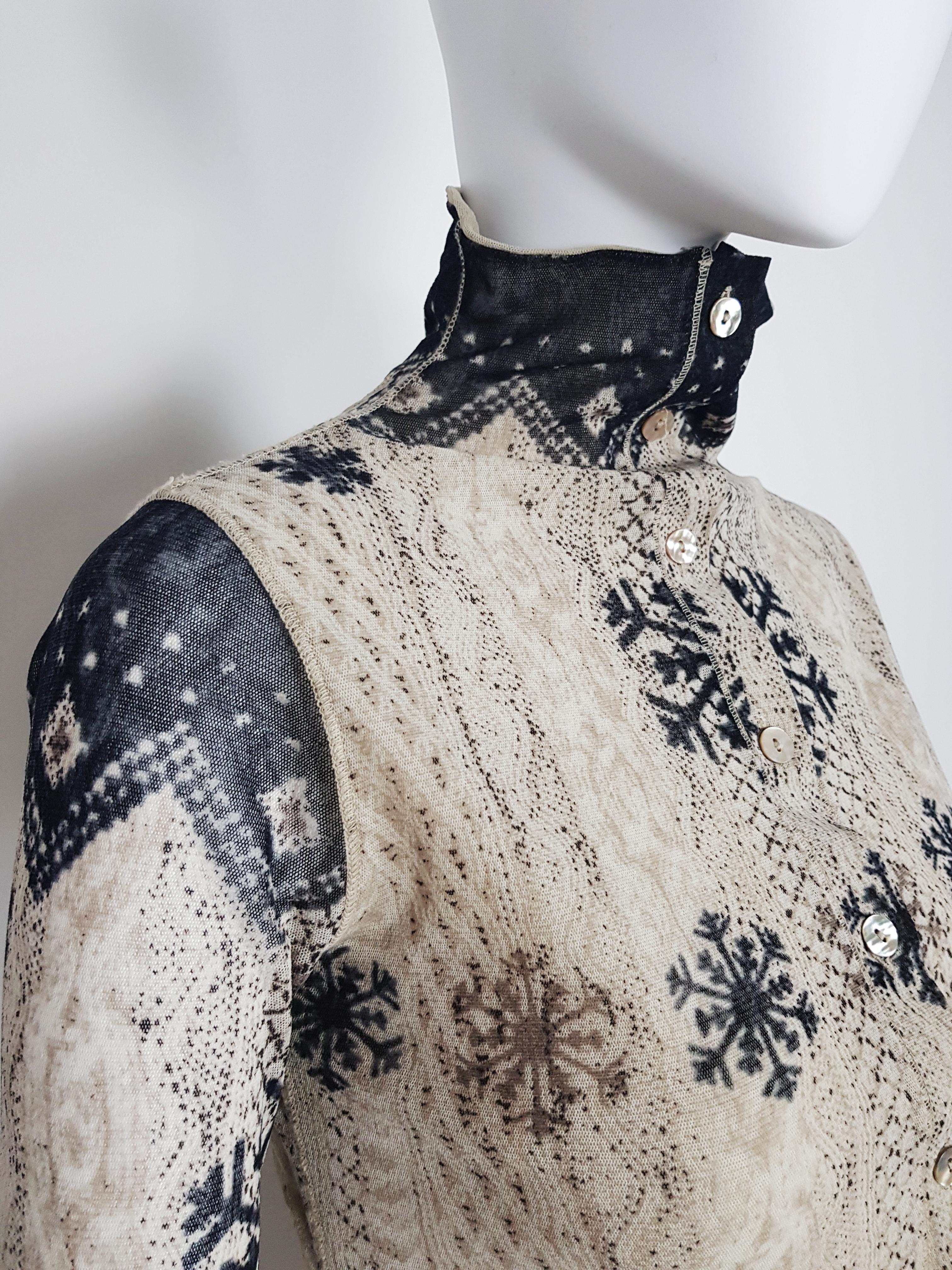 Jean-Paul Gaultier mesh print cardigan top featuring  acardigan knitted Nordic jumper trompe-l'oeil.

-Beige Cream Black colours
-Mother-of-pearl little buttons on frontal closure
-Doble mesh layering
-y2k style
-Very good conditions
-Fits size S to