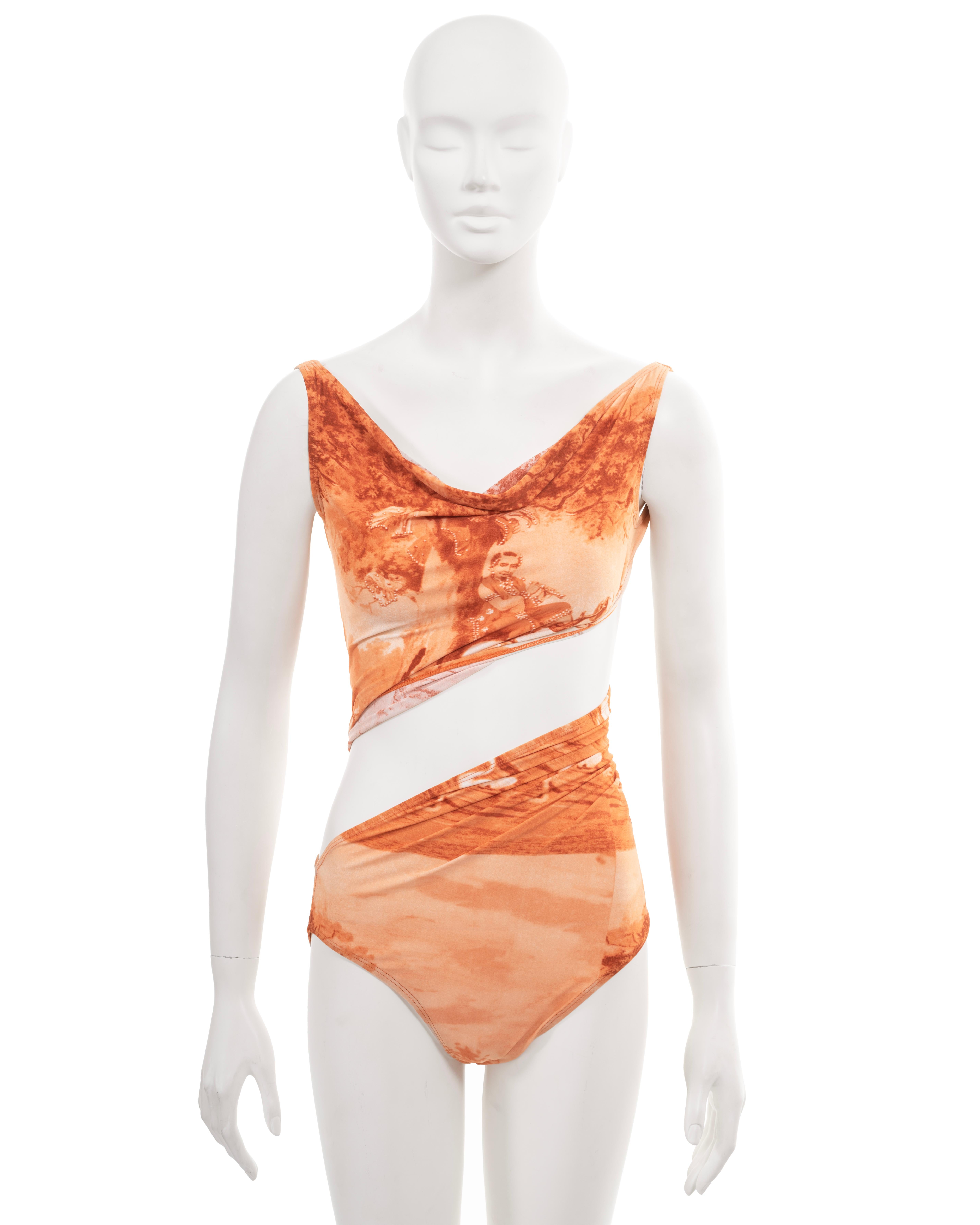 ▪ Archival Jean Paul Gaultier bodysuit 
▪ Spring-Summer 1998
▪ Sold by One of a Kind Archive
▪ Allover orange print features the artwork 'Krishna Leela' by Raja Ravi Varma (1910)
▪ A single piece that wraps around the body, creating a cut-out