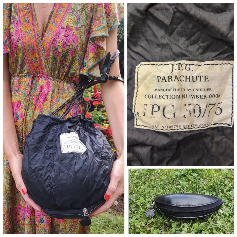 Parachute bag by Jean Paul Gaultier!
Transformable!

Leather case / buttom. 
Extra pocket on the front!
 Strap is adjustable.

NEW without tag! The label`s stye is faded, but it is just the stye, it was not used.
26 x 20 x 16 cm + straps / 10.2 x