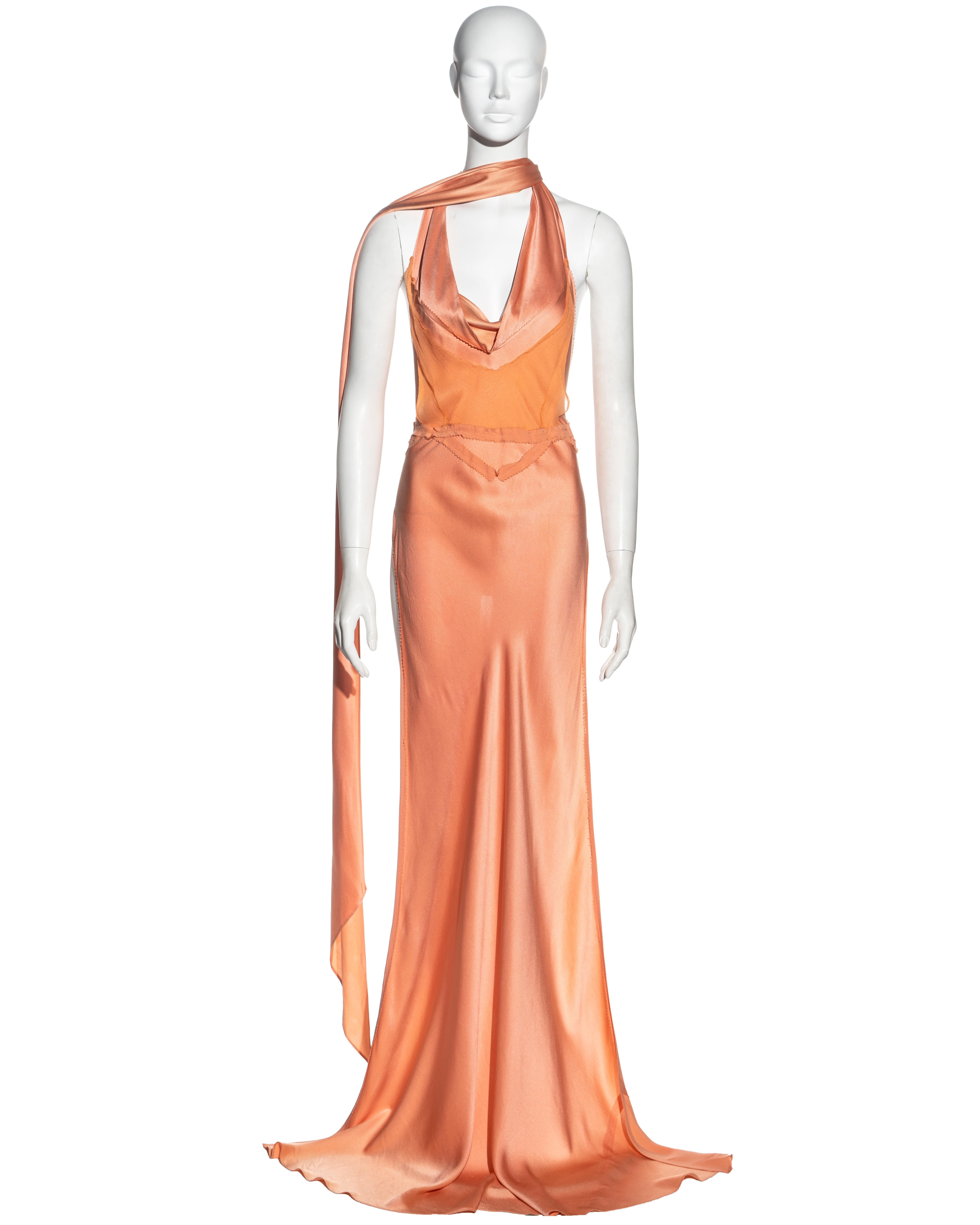 ▪ Jean Paul Gaultier evening maxi top / dress
▪ Constructed from peach bias-cut silk 
▪ Silk chiffon insert with inverted pinked seam detail 
▪ Cowl neck with two extra long ties 
▪ Completely open back with two ties fastening at the back
▪ Size