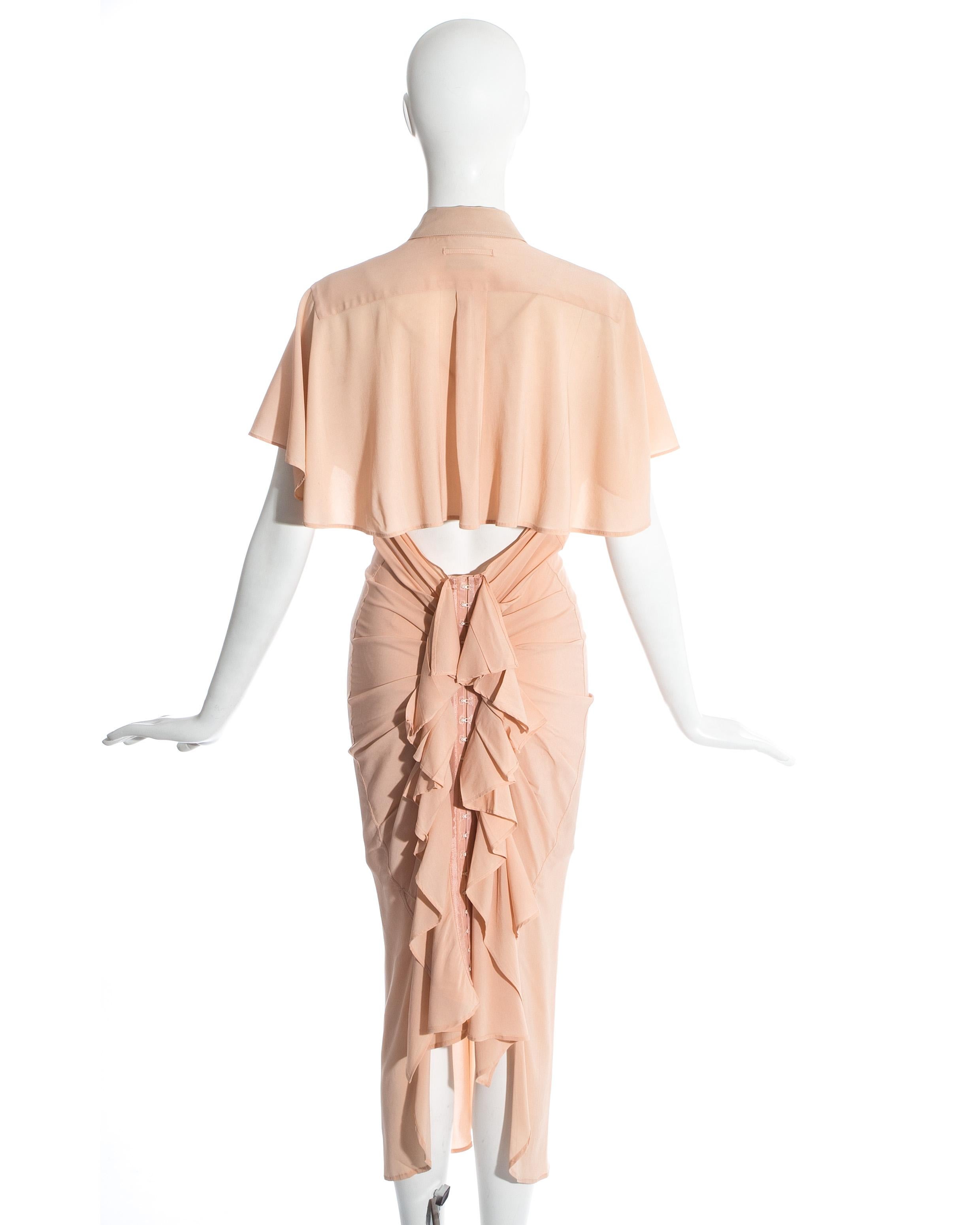 Jean Paul Gaultier peach shirt dress with caplet, open back, and corset skirt with ruffles. Comes with matching slip dress.

Spring-Summer 2005