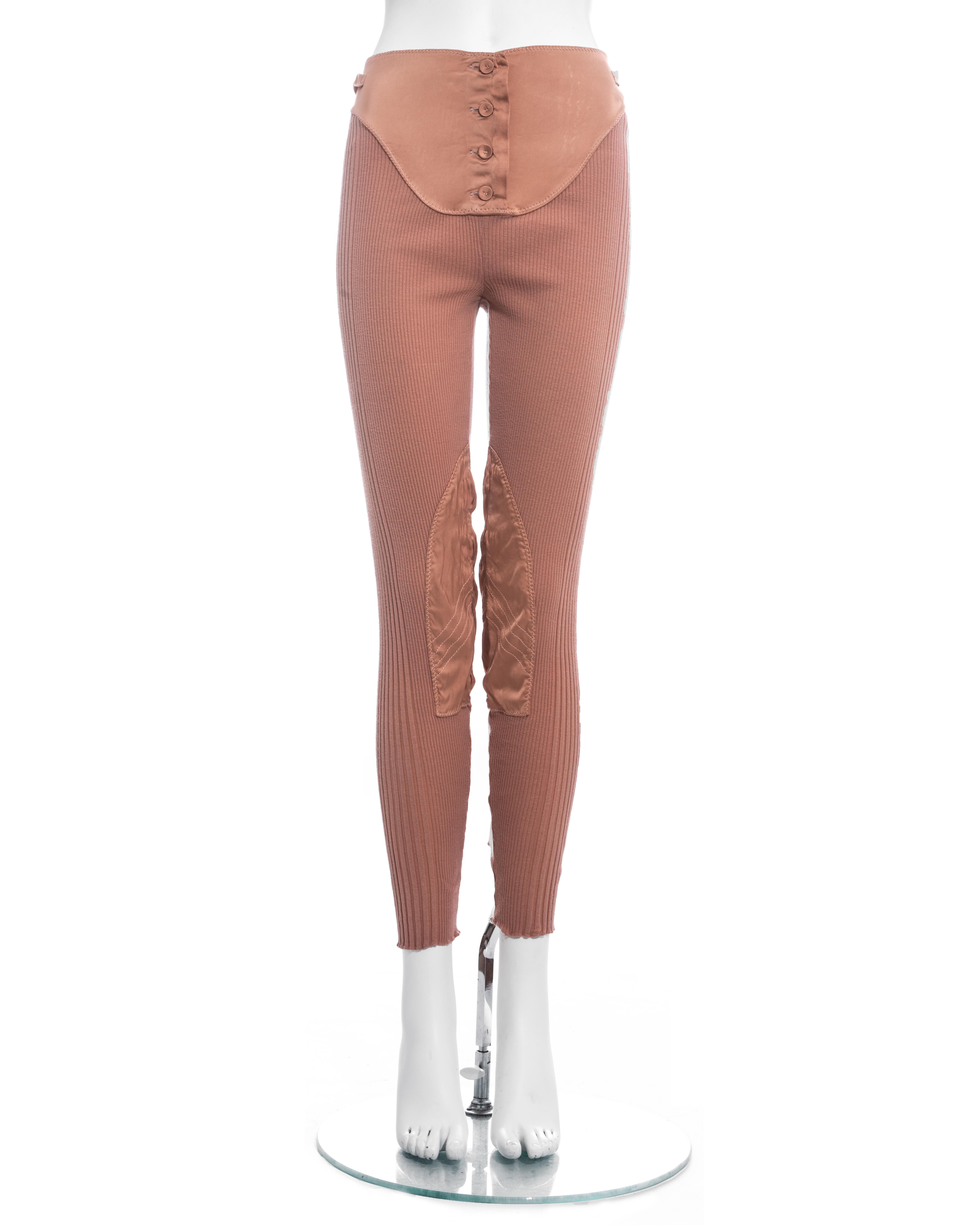Jean Paul Gaultier peach rib-knit wool and satin leggings with lace up and button fastenings.

Spring-Summer 1992