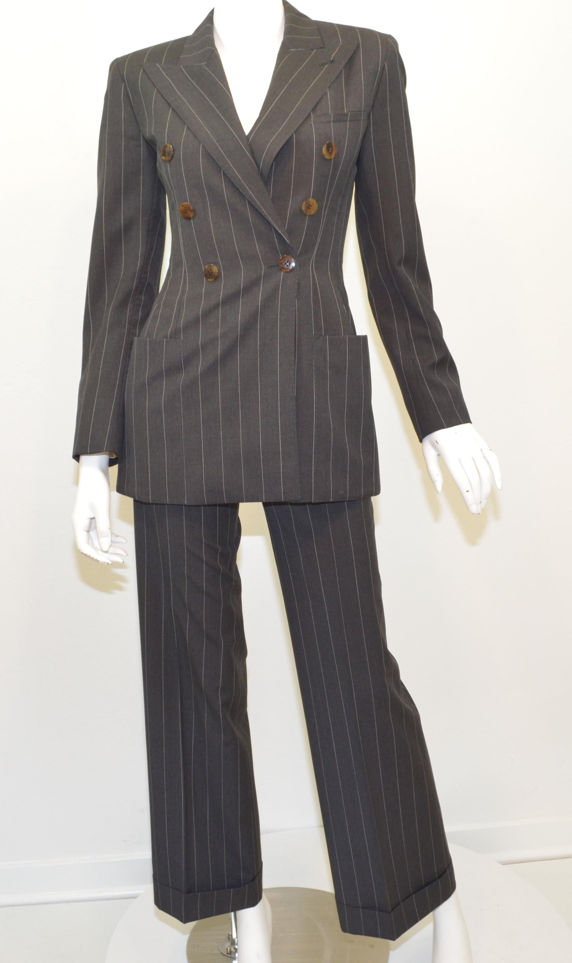 Jean Paul Gaultier Pinstripe Jacket and Pants Suit Set -- featured is grey with a pinstriped pattern throughout. Jacket has button fastenings at the front and an amazing animal print lining. Pants have a zipper and button fastening. Made in Italy,