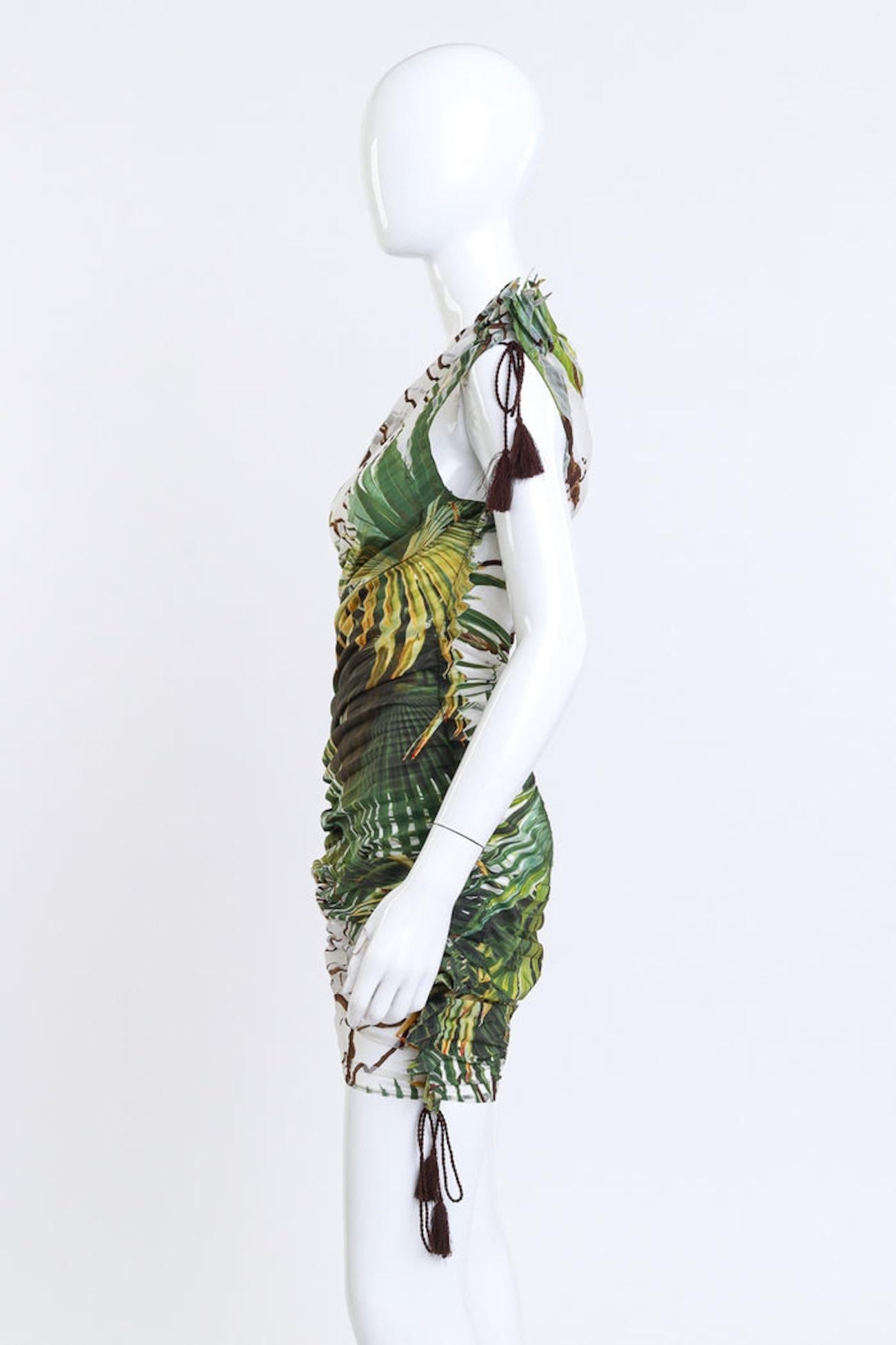 JEAN PAUL GAULTIER PLEATED PALM PRINT FOREST FANTASIA DRESS (US 6)

This Jean Paul Gaultier Femme chiffon dress is from the Spring 2010 Couture Collection and features a lush tropical jungle print seen on the runway. Designed with a semi-sheer
