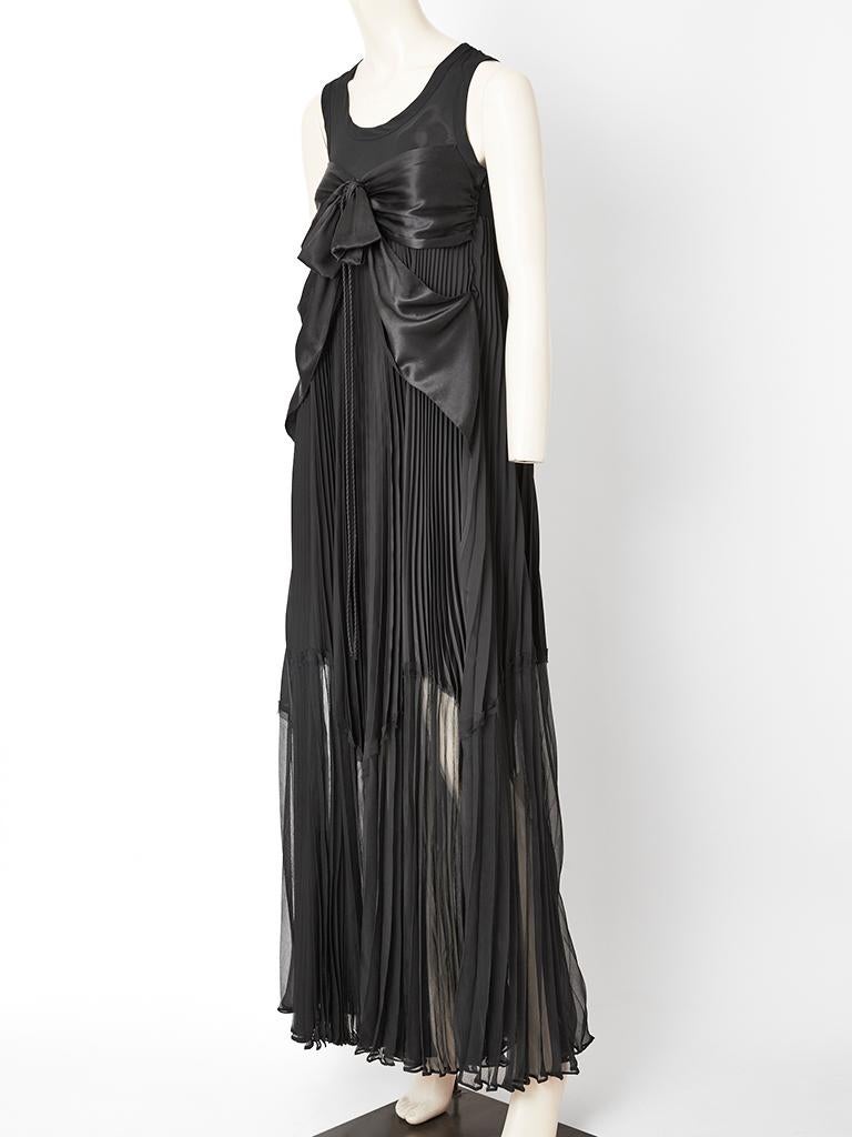 Jean Paul Gaultier,  sheer chiffon and satin combination maxi dress having a sleeveless tee shirt like bodice with a empire waist satin band having a stationary bow. Skirt is a mix of satin and chiffon. The satin part starts under the bust and ends