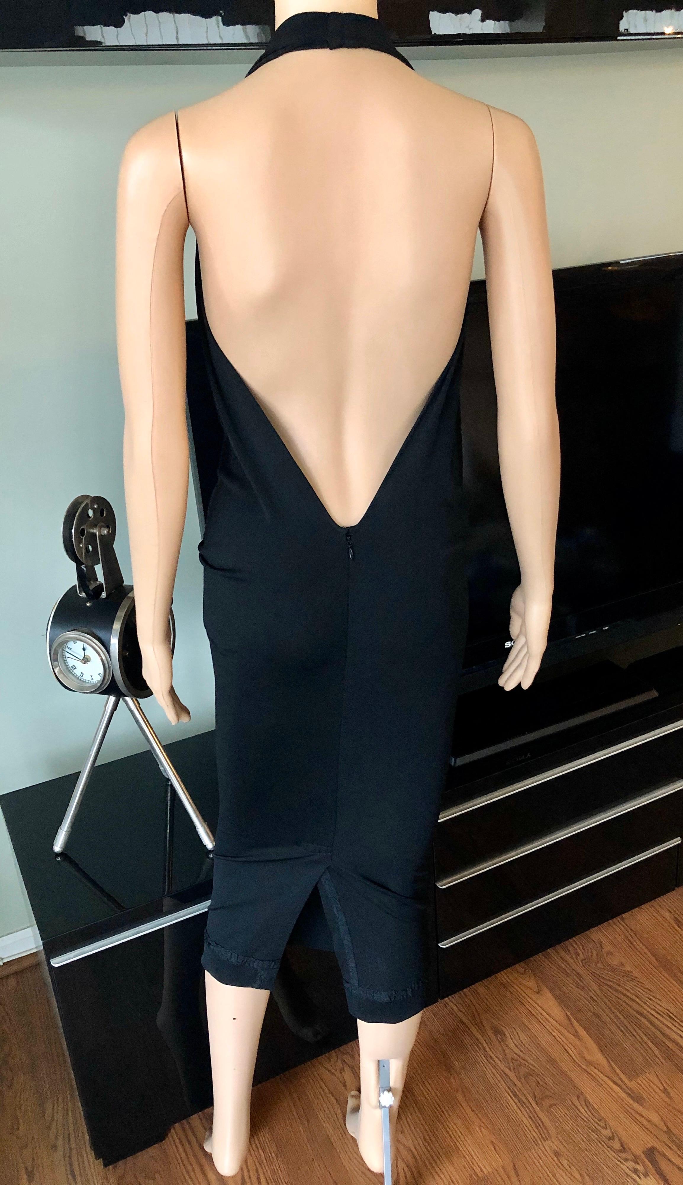 Jean Paul Gaultier Plunging Neckline Draped Halter Open Back Black Dress XS/S

Jean Paul Gaultier draped halter dress featuring plunging neckline, open back and zip closure at back. Please note size tag has been removed, size is estimated from