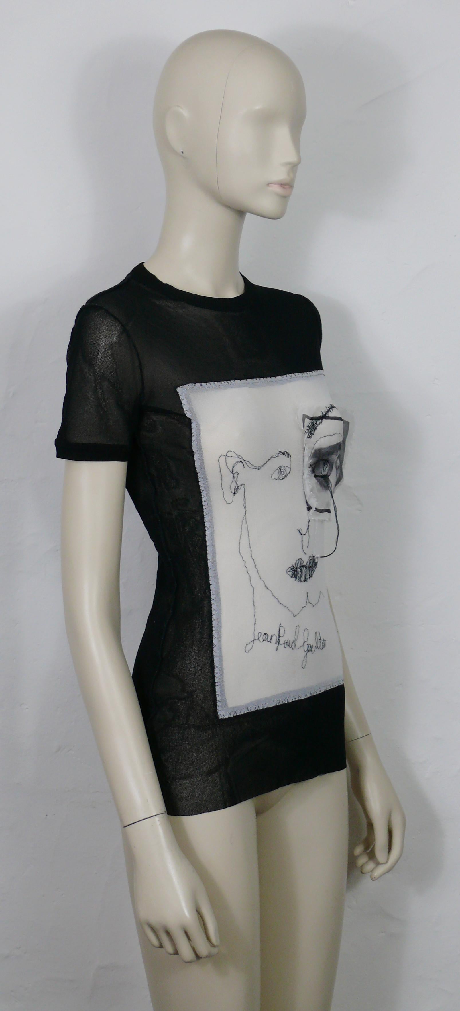 JEAN PAUL GAULTIER vintage black sheer mesh short sleeve top with embroidered portrait and eye applique.

This stretchy mesh nylon top is embroidered with black JEAN PAUL GAULTIER cursive signature.

Label reads JEAN PAUL GAULTIER Maille Femme.
Made
