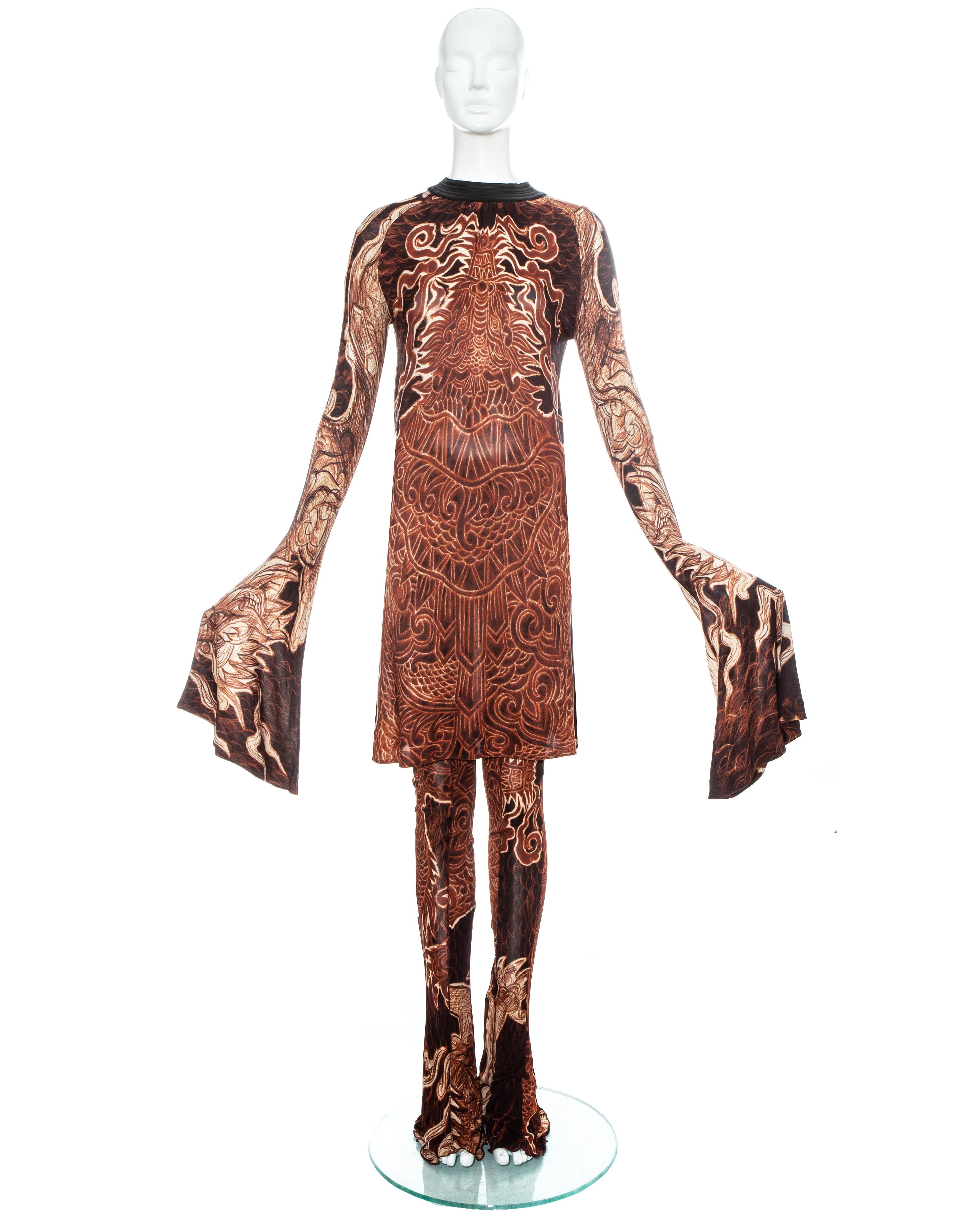 Jean Paul Gaultier printed jersey bell sleeve tunic with leather collar, sold with matching high waisted bell bottom pants

Fall-Winter 2008