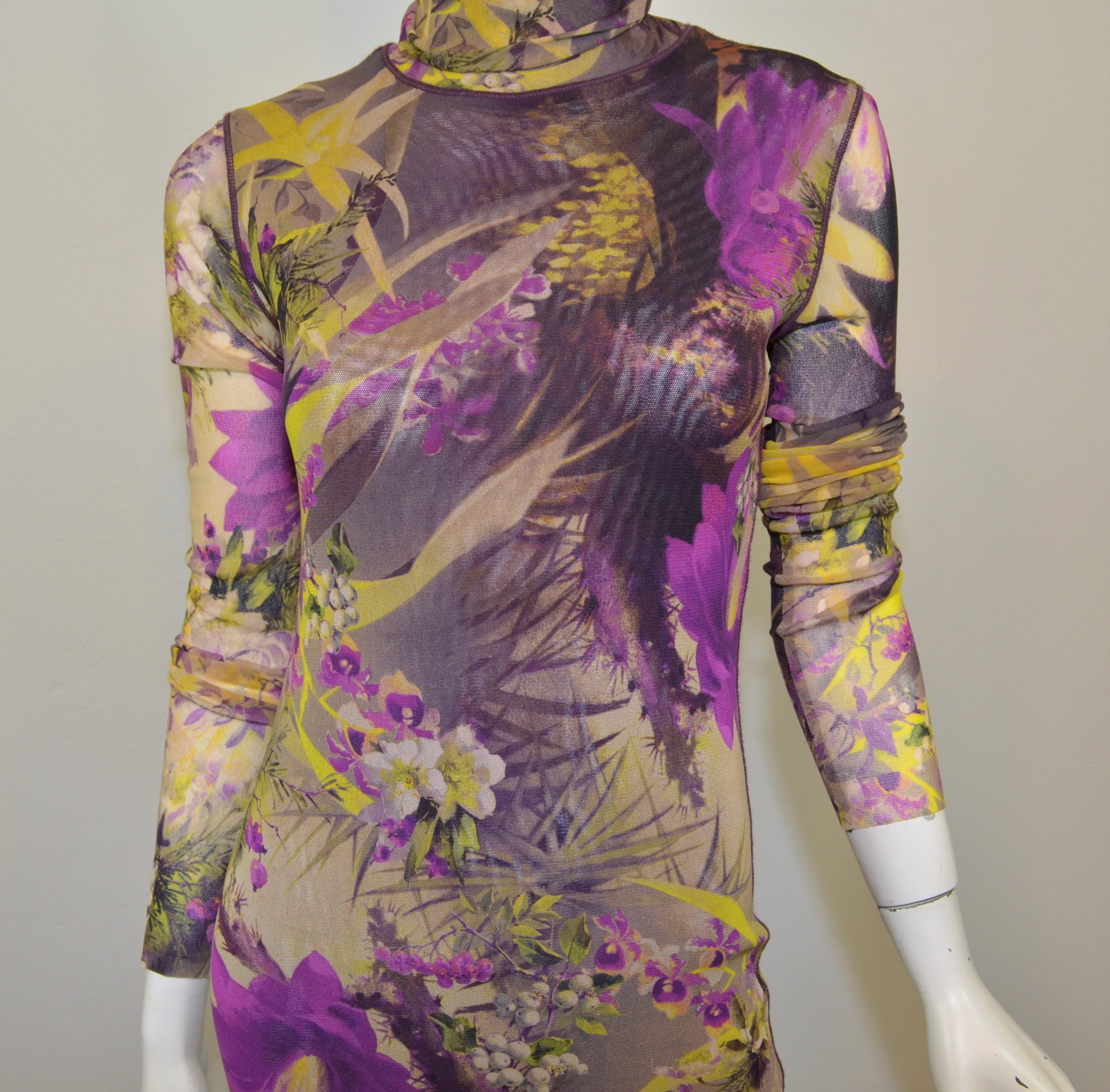 Jean Paul Gaultier mesh dress is featured in a mixed purple and black print throughout with a turtleneck design and long sleeves. Dress is a size large and is in excellent condition.

Measurements:
Bust 33''
Sleeves 26''
Waist 28''
Hips 30''
Length