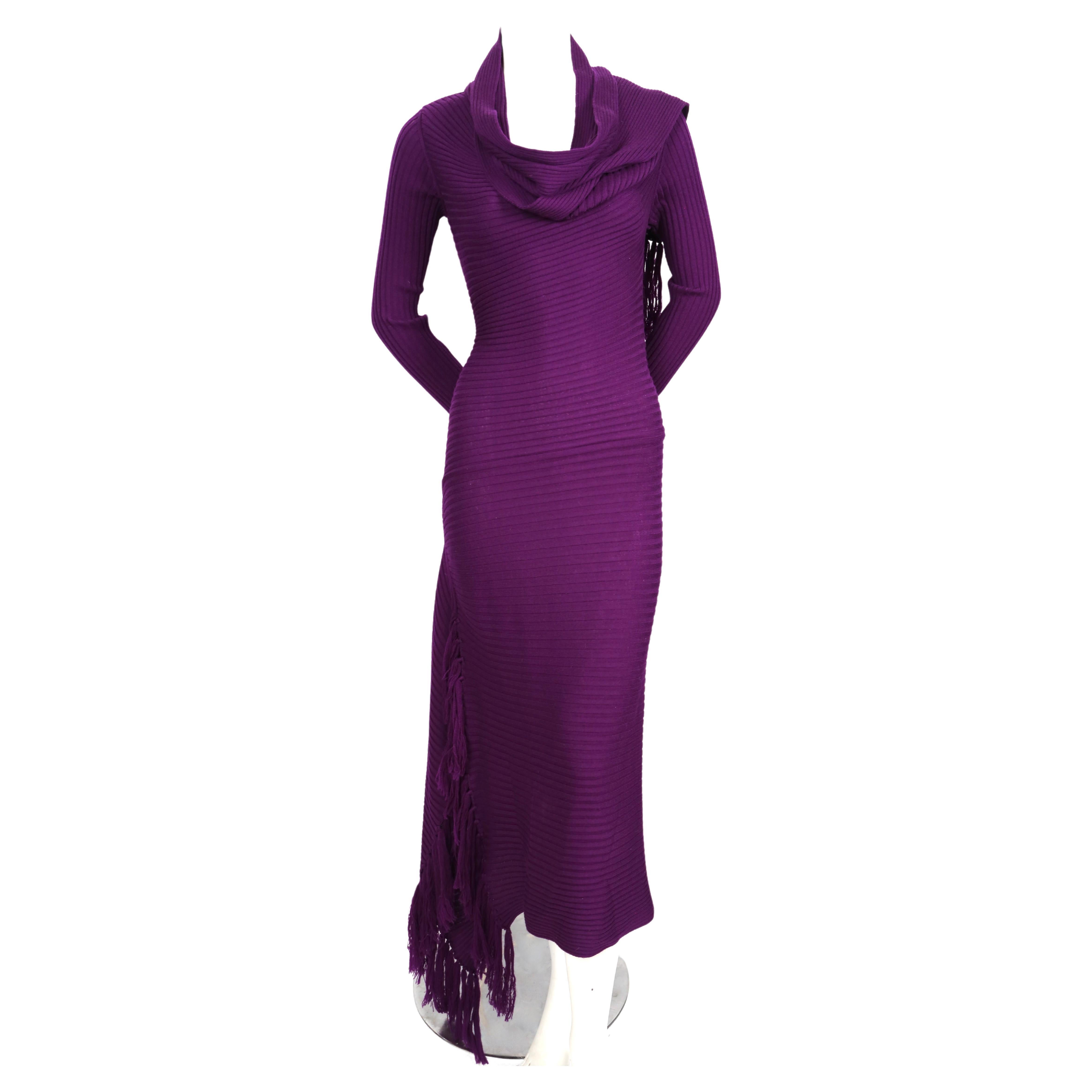 Vivid-purple, ribbed, knit dress with spiral cut and attached scarf designed by Jean Paul Gaultier dating to the late 1990's, early 2000's. Labeled a size 'M'. Approximate measurements (unstretched): bust 31-32