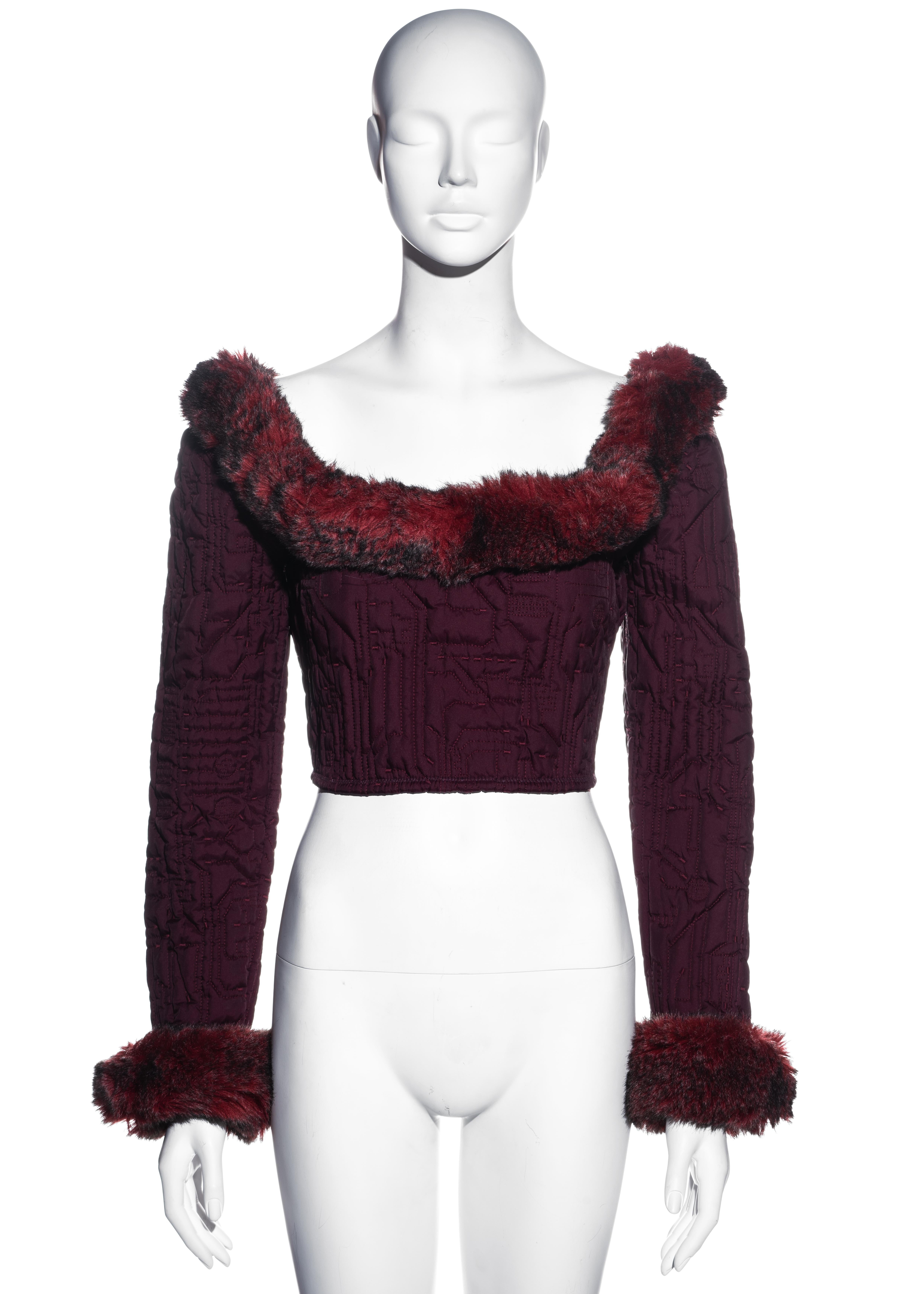 ▪ Jean Paul Gaultier plum corset top
▪ 100% Polyester 
▪ Embroidered circuitboard design 
▪ Faux fur trim around collar and cuffs 
▪ Back zip fastening  
▪ IT 44 - FR 40 - UK 12 - US 10
▪ Fall-Winter 1995