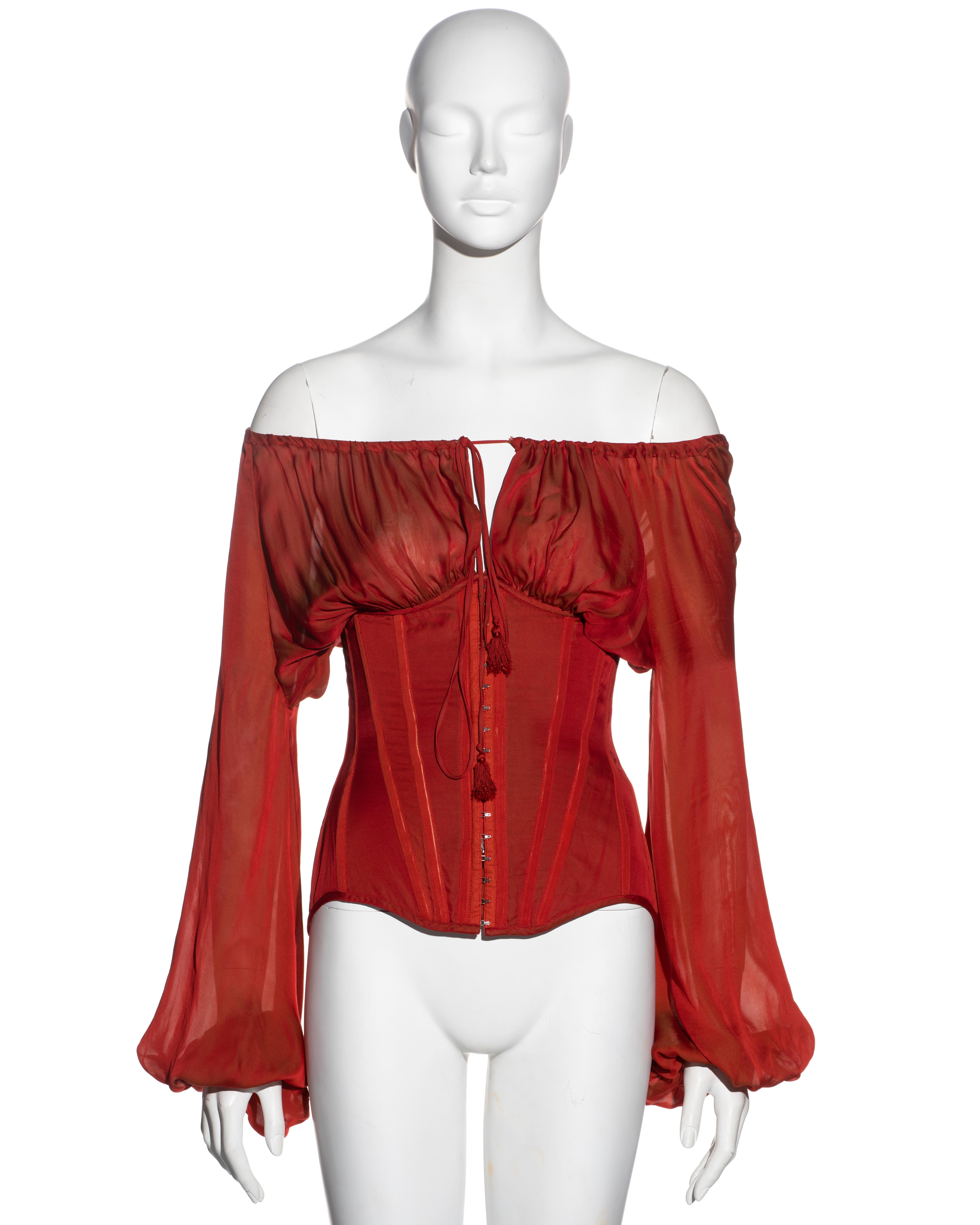 ▪ Jean Paul Gaultier corset 
▪ Sold by One of a Kind Archive 
▪ Constructed from red silk
▪ Full sleeves
▪ Off-shoulder neckline with drawstring ties 
▪ Structured bodice with multiple built-in corset bones 
▪ Metal corset hooks conceal a metal