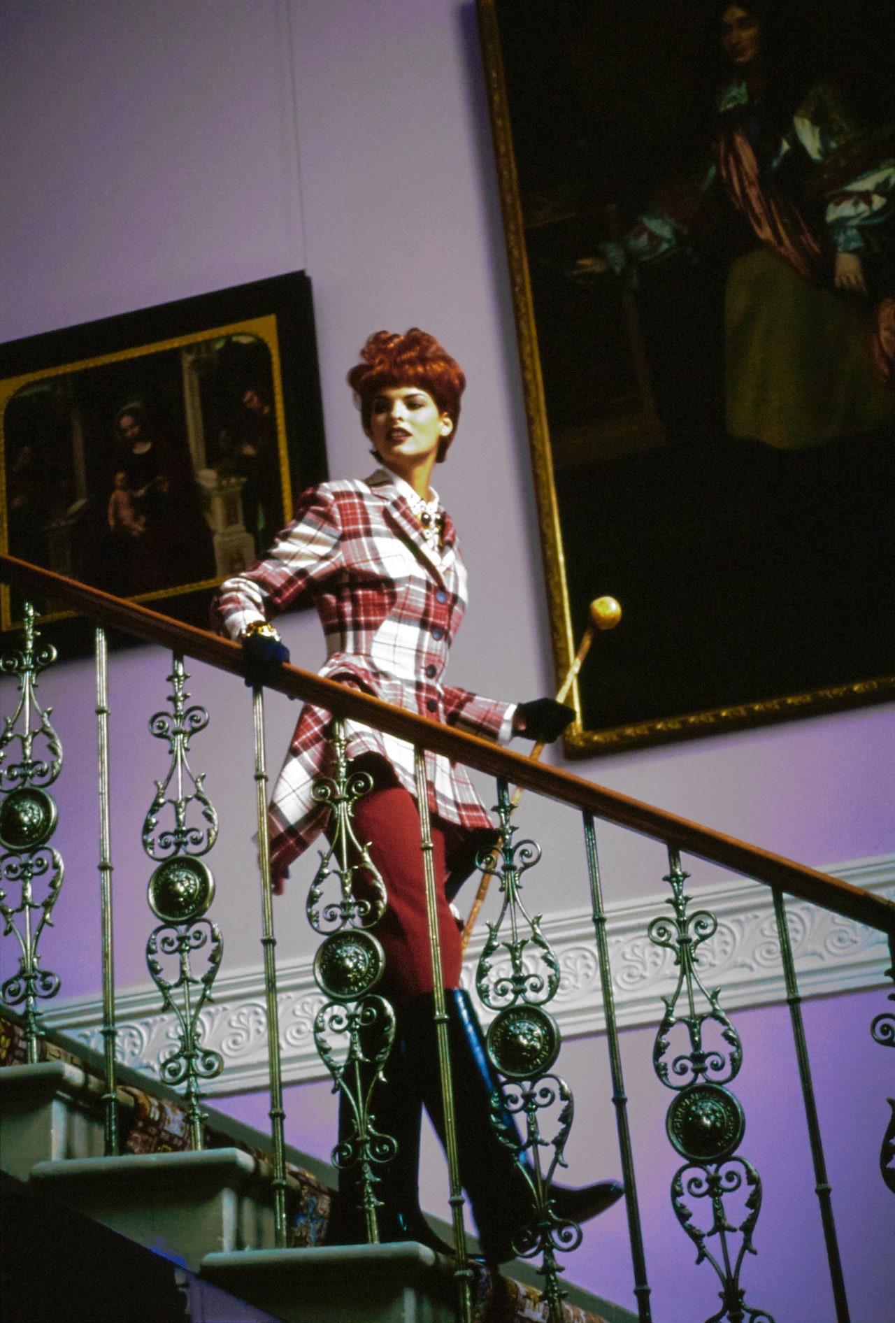 Jean Paul Gaultier red tartan wool blanket skirt suit. Structured blazer jacket with four button closures, two front flap pockets, accentuated waist and wide hips. Sold with matching mini skirt made from a rectangular blanket, longer at the sides