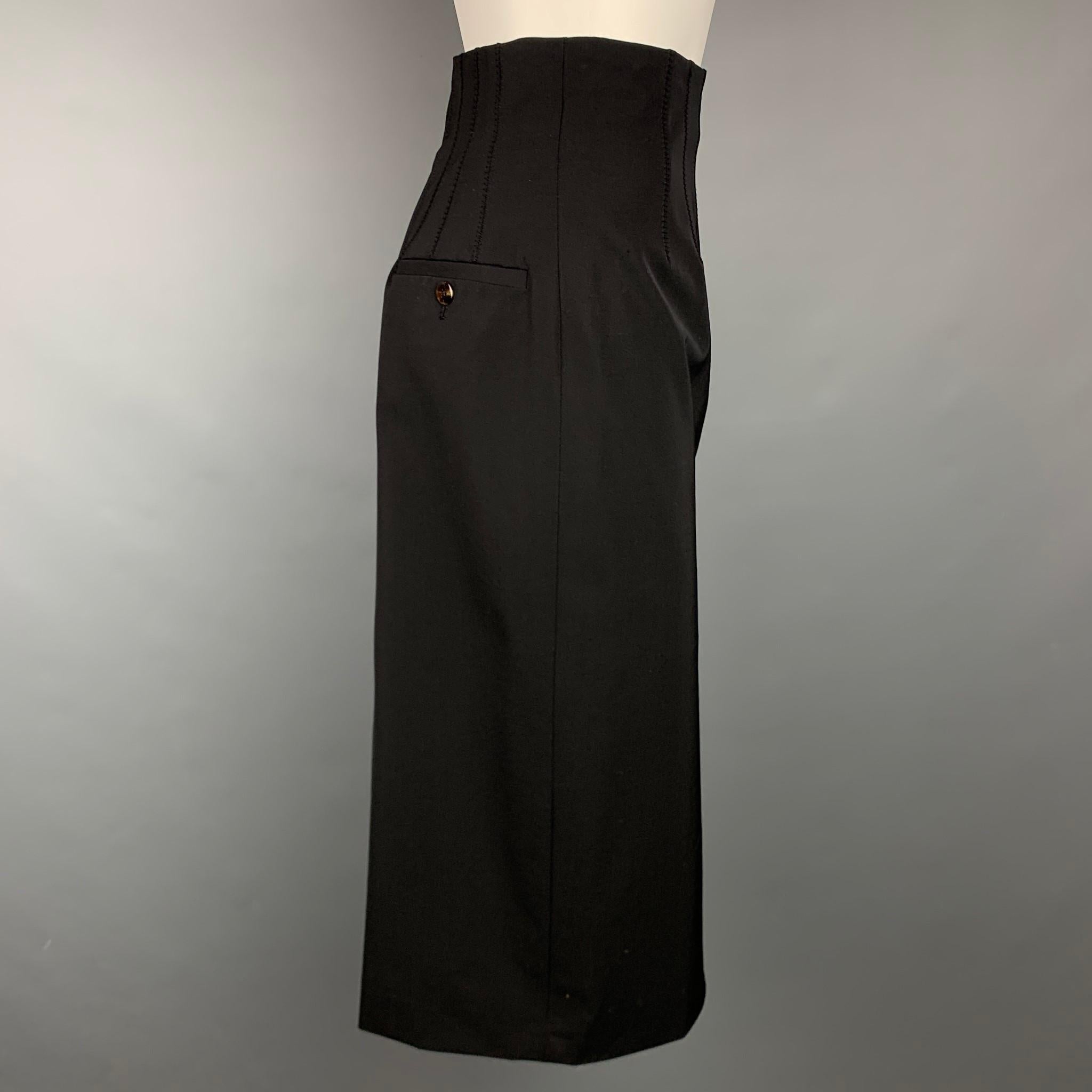 JEAN PAUL GAULTIER Reedition 1993/1994 skirt comes in a black wool / polyester with a slip liner featuring a high waisted style, front pleats, back double front tabs, and a back zipper closure. Made in Italy.

Very Good Pre-Owned Condition.
Marked: