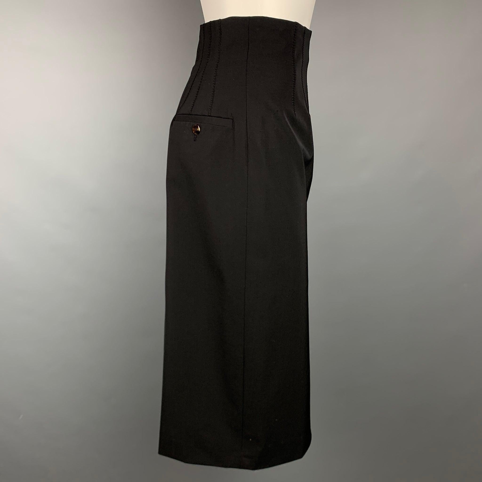 JEAN PAUL GAULTIER Reedition 1993/1994 skirt comes in a black wool / polyester with a slip liner featuring a high waisted style, front pleats, back double front tabs, and a back zipper closure. Made in Italy.Very Good
Pre-Owned Condition. 

Marked: 