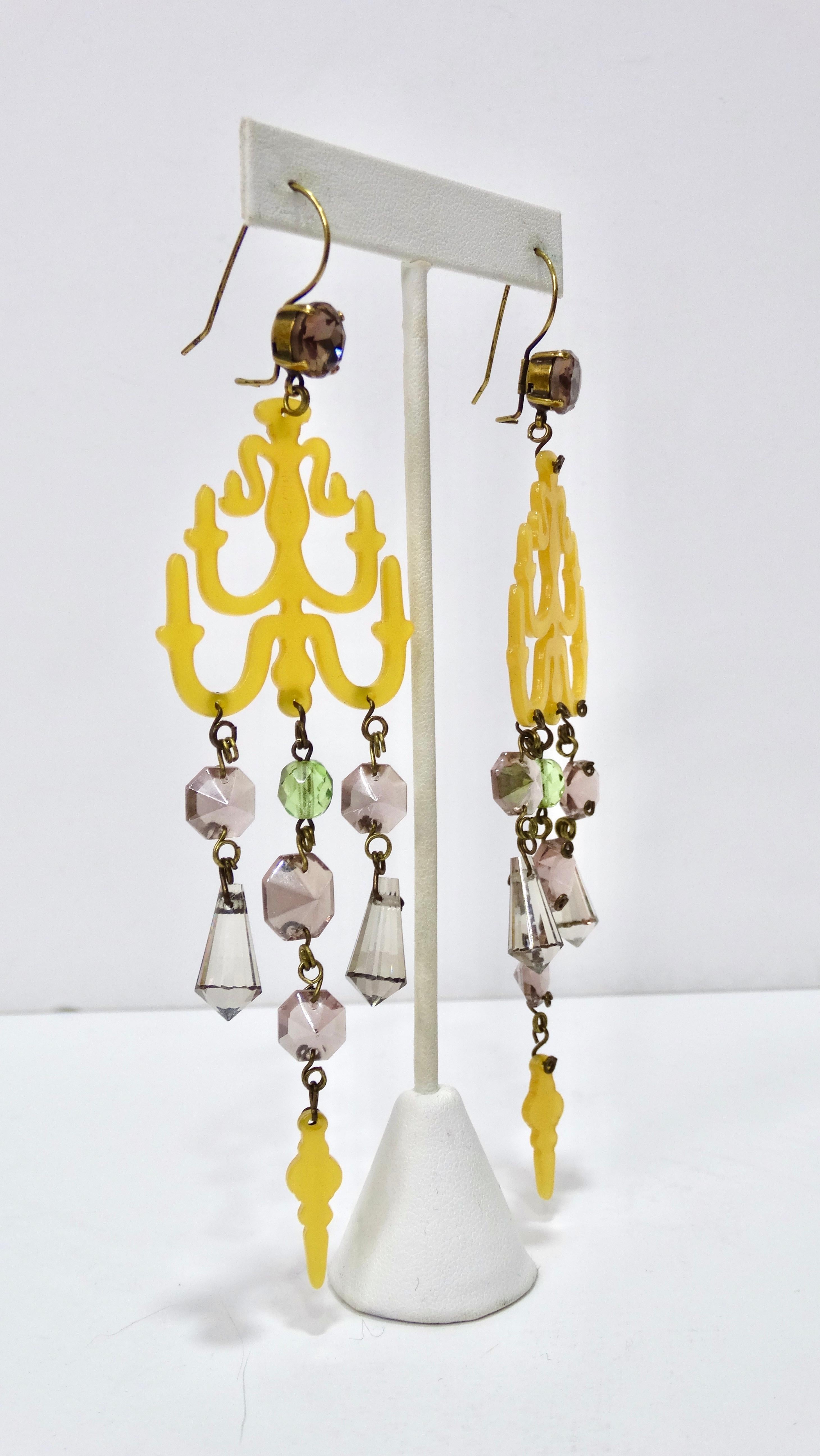 These fun and flirty Jean Paul Gaultier earrings are a vintage gem from the 1990's. They feature a yellow resin chandelier design complimented with dangling crystals. These are a large size, measuring 5.5 inches. Pair with your favorite Roberto