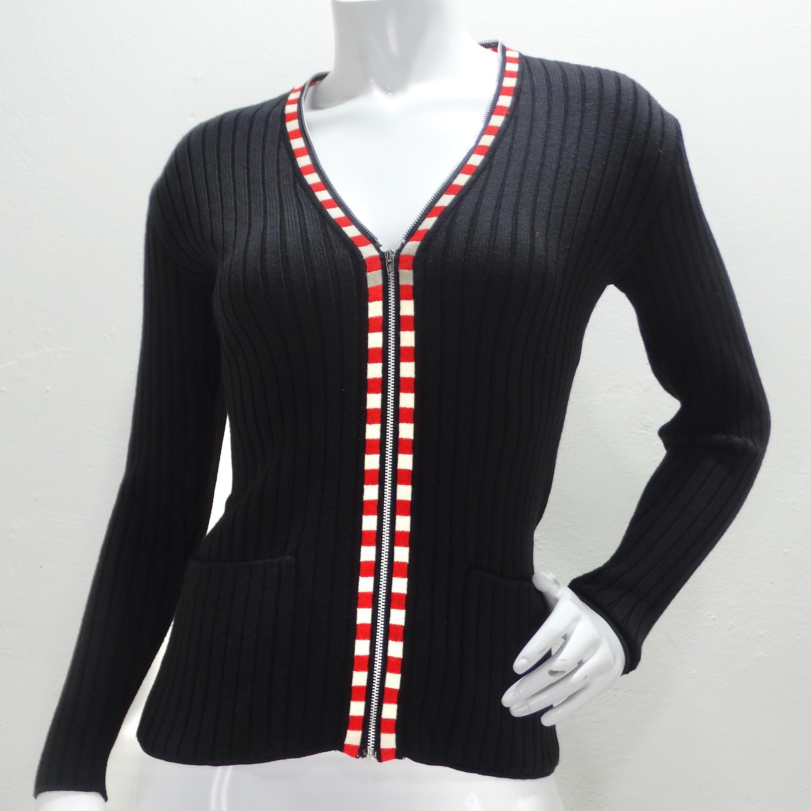 Step back in time with this iconic 1990s Jean Paul Gaultier rib-knit zip-up sweater. Crafted from a luxurious and thick black rib-knit fabric, this sweater exudes style and sophistication. Its standout feature is the striking red and white trim that