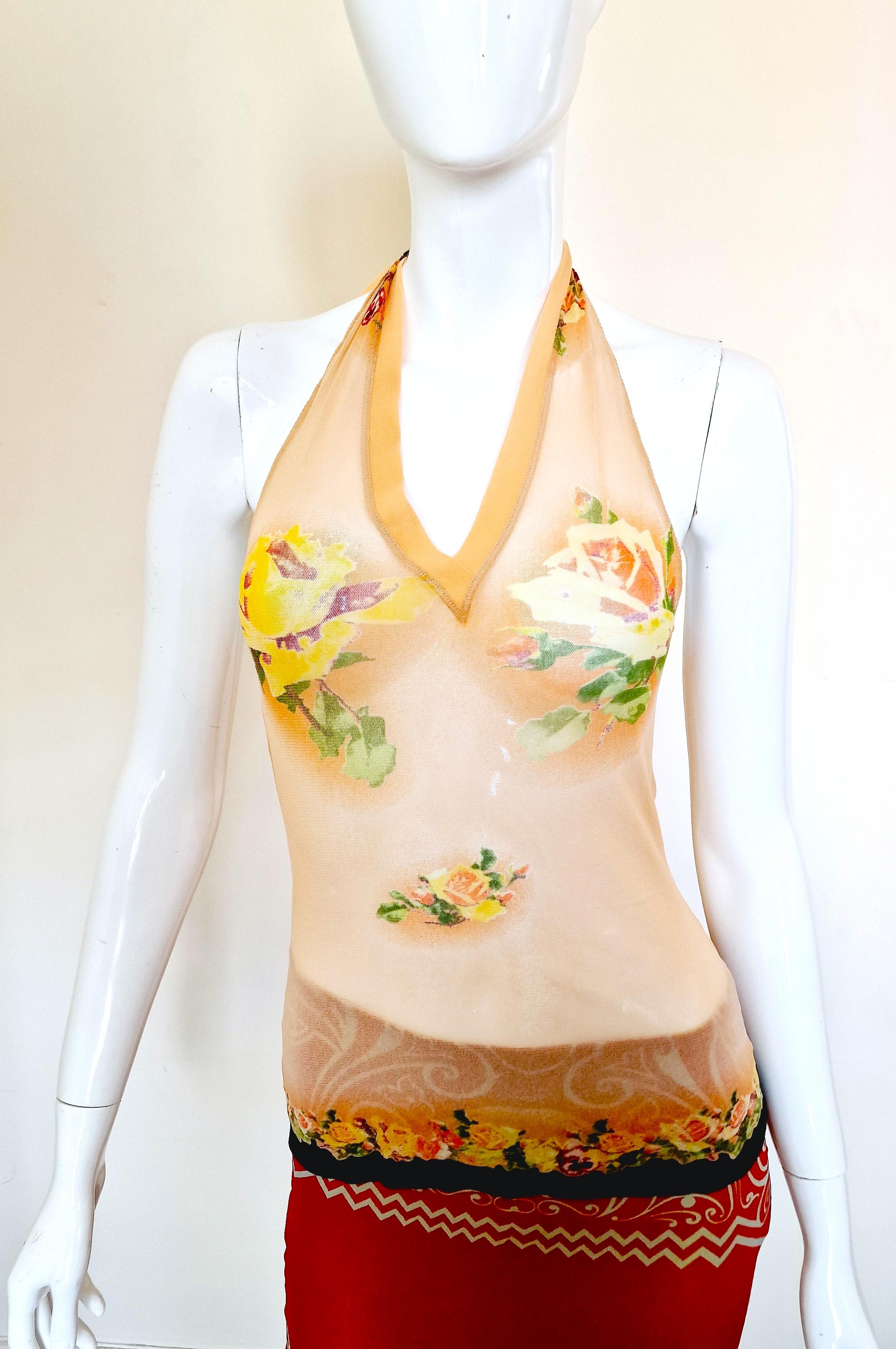 Floral tattoo mesh top by Jean Paul Gaultier!
This is the original collection which was tributed by Supreme.
The roses covers the breasts and the navel :)
The same pattern was worn by Kendall Jenner in Los Angeles, 2022 summer and Kylie Jenner in
