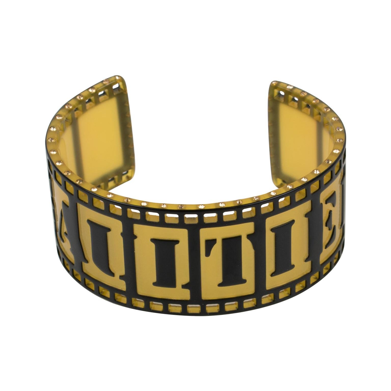 This striking Jean Paul Gaultier Paris resin cuff bracelet features an old-fashioned film strip design with carving and see-thru pattern with wide 