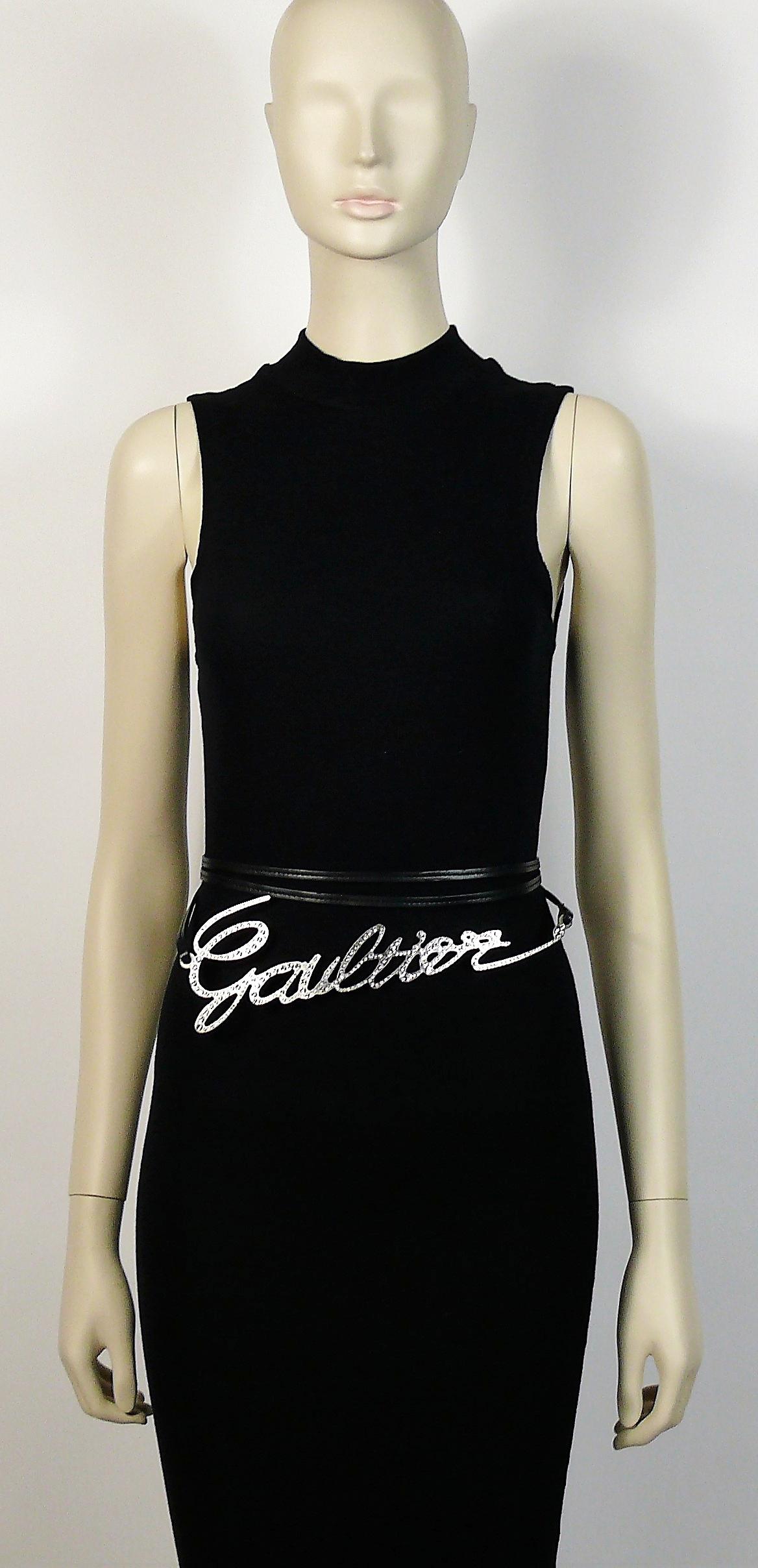 JEAN PAUL GAULTIER cursive logo metal chrome belt featuring clear crystal embellishement and black leather cords that tie in the back.

One size fits all.
Can be worn in several ways.

Indicative measurements : total length approx. 300 cm (118.11