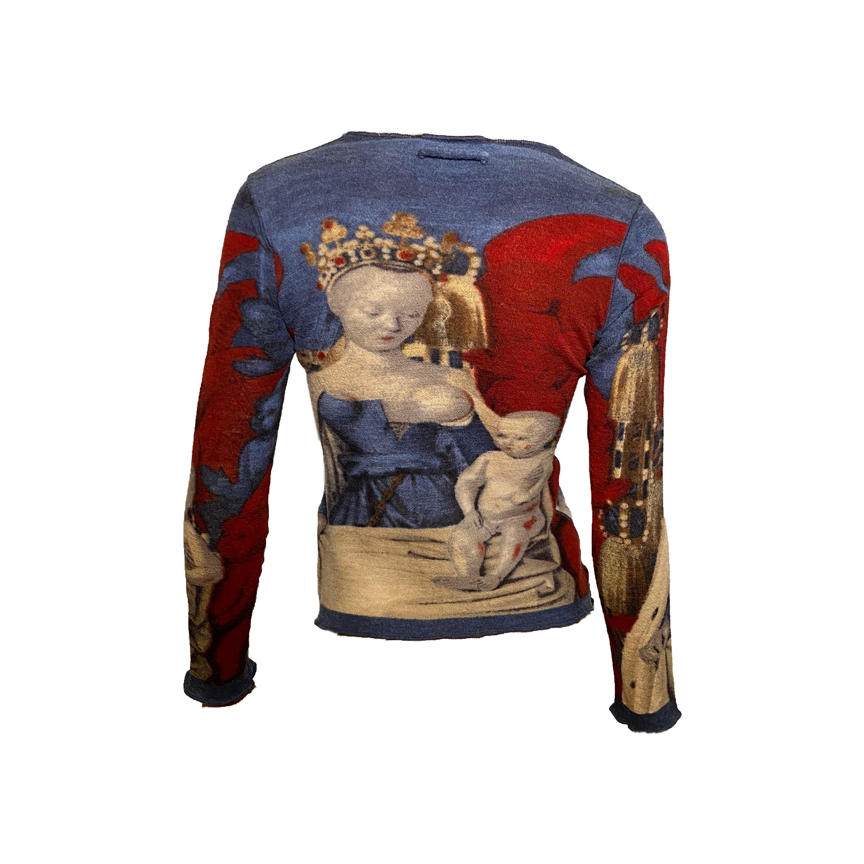 Jean Paul Gaultier long sleeve top from Spring/Summer 1995 featuring “Virgin and Child Surrounded by Angels” print by French painter Jean Fouquet.
Wool Blend

Measurements:
Shoulder to shoulder: 36,5 cm/14,3 inch Pit to pit: 40 cm/15,7 inch
Sleeve