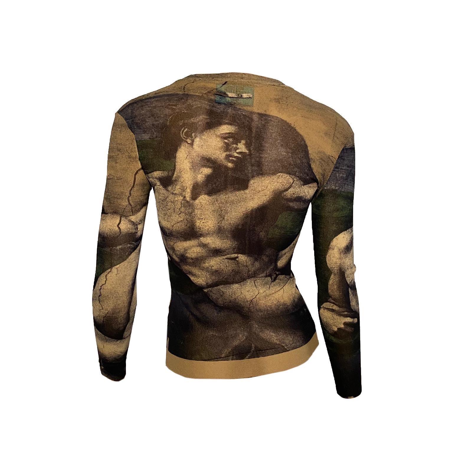 Jean Paul Gaultier long sleeve top from Spring/Summer 1995 featuring “The Creation of Adam” print by Michelangelo.

100% Polyamide 

Marked as size L but runs smaller

Shoulder to shoulder: 39 cm/ 15,3 inch
Pit to pit: 38 cm/ 14,9 inch
Shoulder to