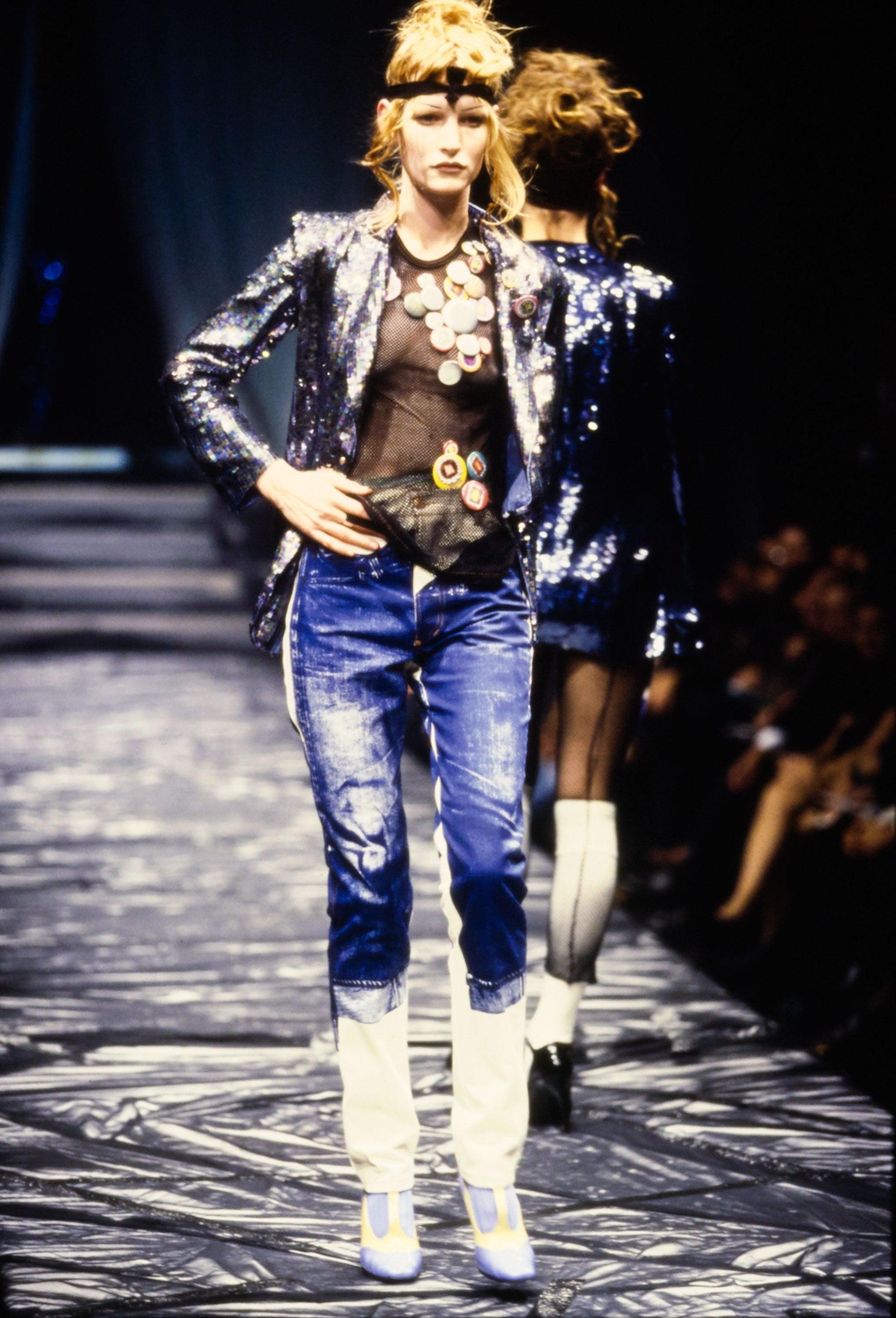 Dating to the S/S 1997 runway collection, these Gaultier Jeans by Jean Paul Gaultier pants are a perfect example of Gaultier's ability to turn everyday fashion into art. They are a high-waisted and straight legged-style, and feature a stunning