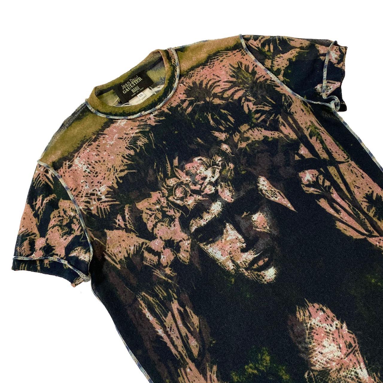 Jean Paul Gaultier mesh t-shirt featuring Polynesian print from the Spring/Summer 2000 collection

Size XL, stretchable fabric 

Shoulder to shoulder - 40cm / 15,7 inches 
Pit to pit - 45cm / 17,7 inches 
Shoulder to waist - 65cm / 25,5 inches