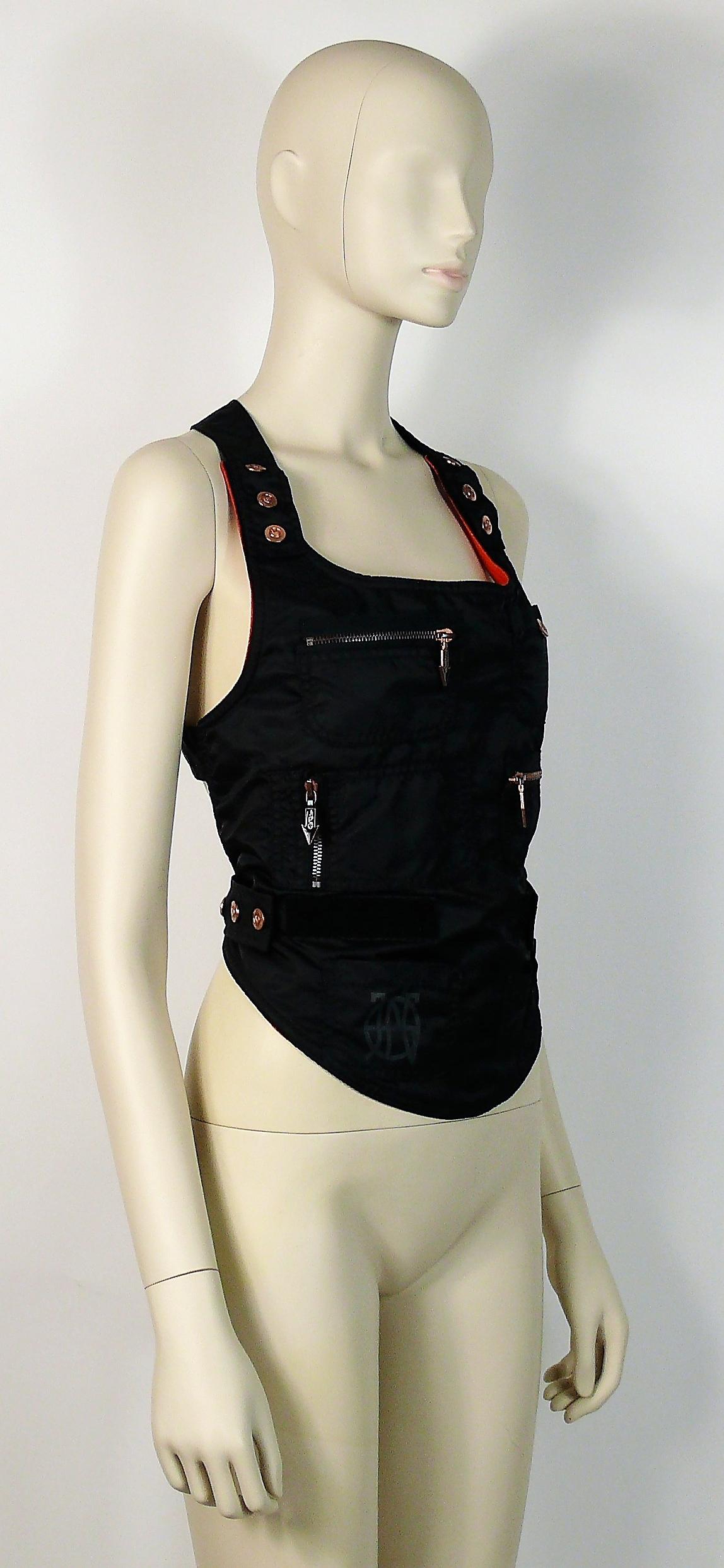 JEAN PAUL GAULTIER rare SAFE SEX nylon bondage backless utilitarian vest.

This vest features :
- Black nylon with cross bondage detailing at the back.
- JPG logo and JPG Safe Sex print.
- Straps have adjustable snap buttons and velcro fastening at