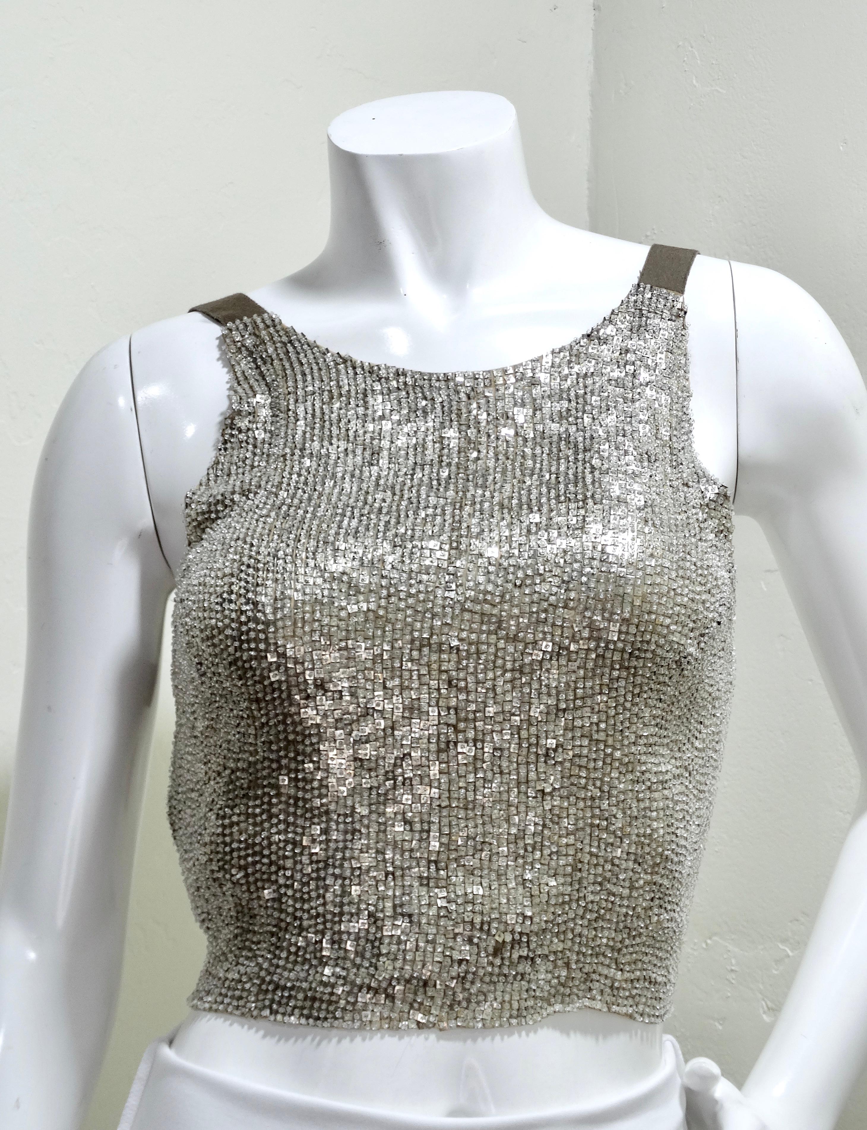 Jean Paul Gaultier paired sequins and an open back for your most perfect going-out top. He knew just how to balance the daring and the delicate by adding beautiful tie-detailing on the back. Details include sparkling silver sequins, two back-ties,