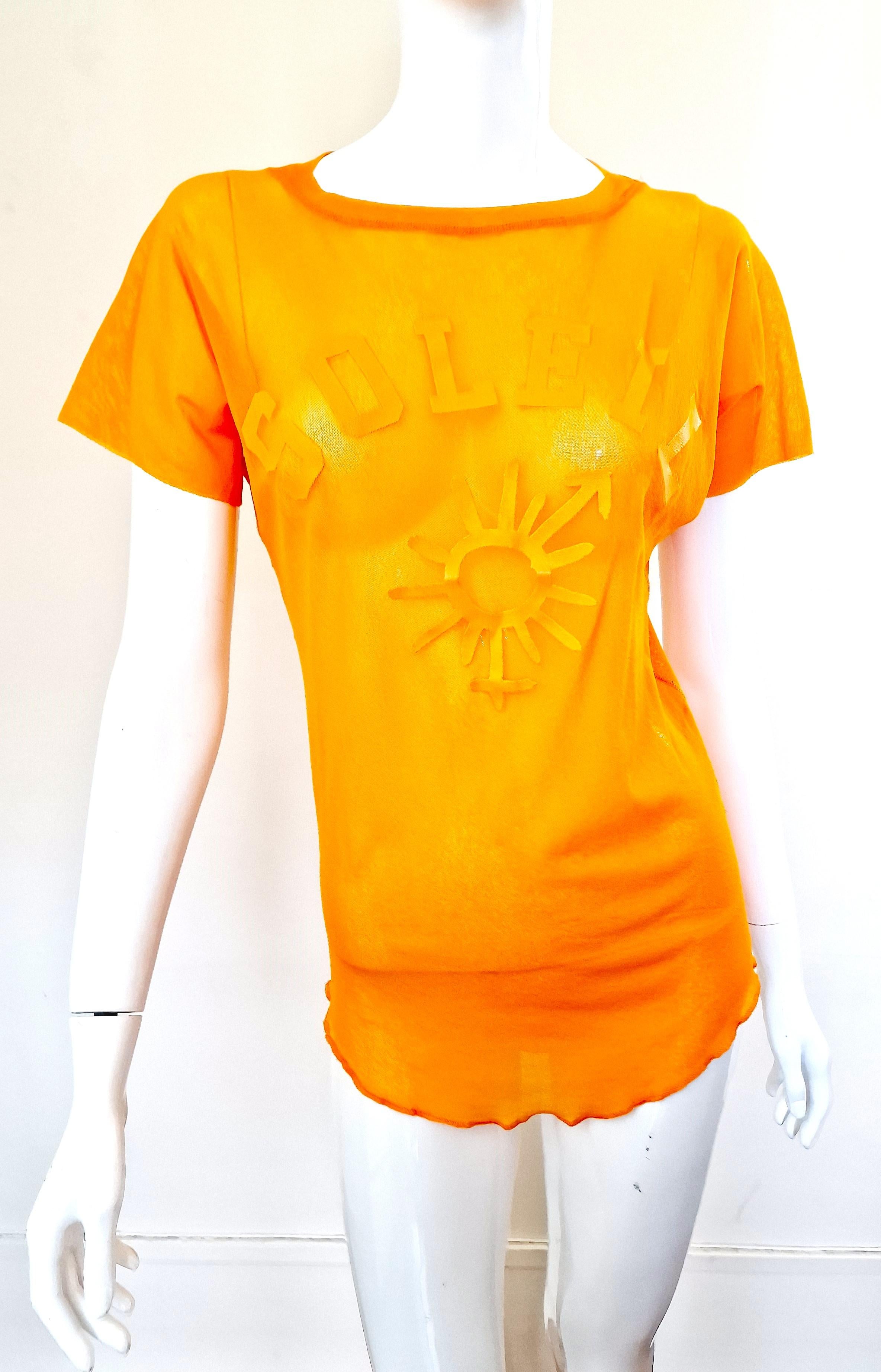 Symbol mesh top by Jean Paul Gaultier!
Big Soleil and Gaulter logo (Female and male symbol) on it!
Transparent.

EXCELLENT condition!

SIZE
Men:fits from medium to XL.
No size label. Extremly stretchy fabric.
Length: 63 cm / 24.8 inch
Bust: 52 cm /